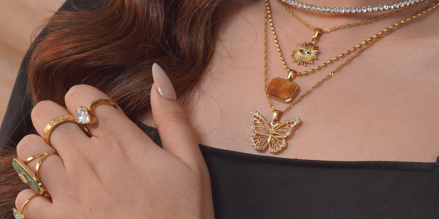 Girl Wearing Inheritance Jewelry Necklaces and Rings 18k GOld Plated Bought from Mithra and Co.