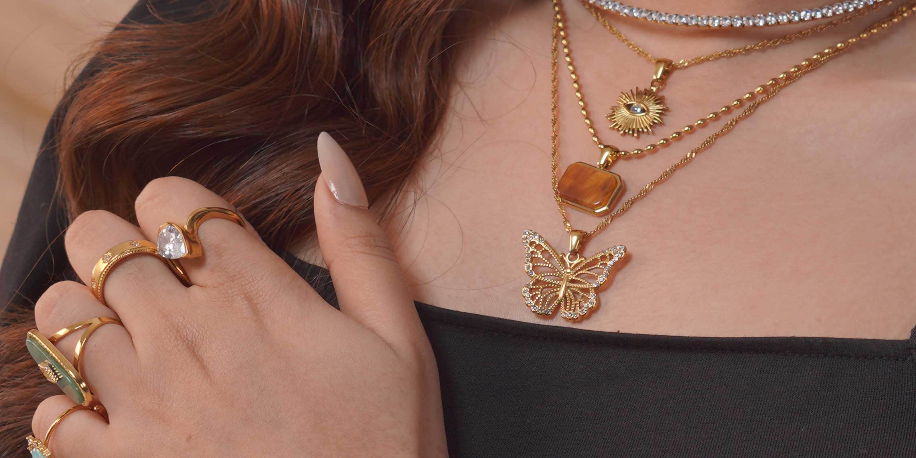 Girl Wearing Inheritance Jewelry Necklaces and Rings 18k GOld Plated Bought from Mithra and Co.