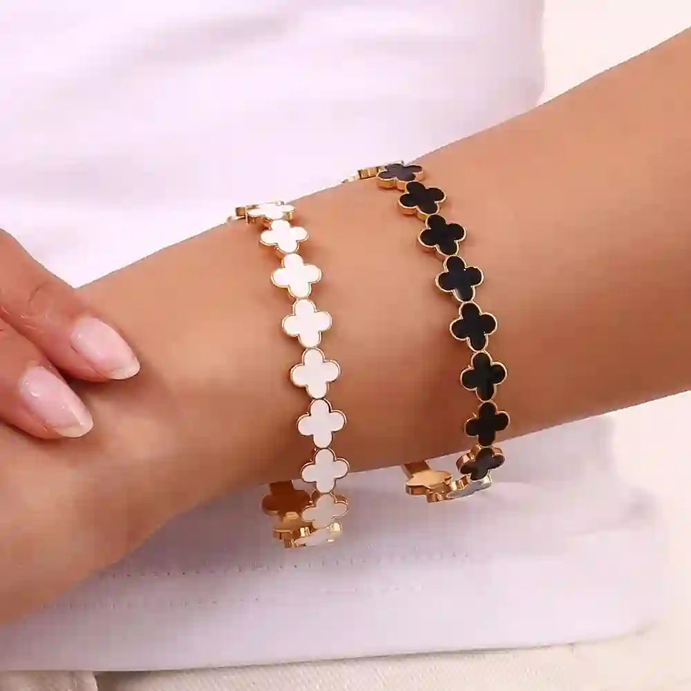 GIrl wearing 18k Gold Plated Open Cuff Bracelet. Ebony Black and Ebony White. Shop Now.