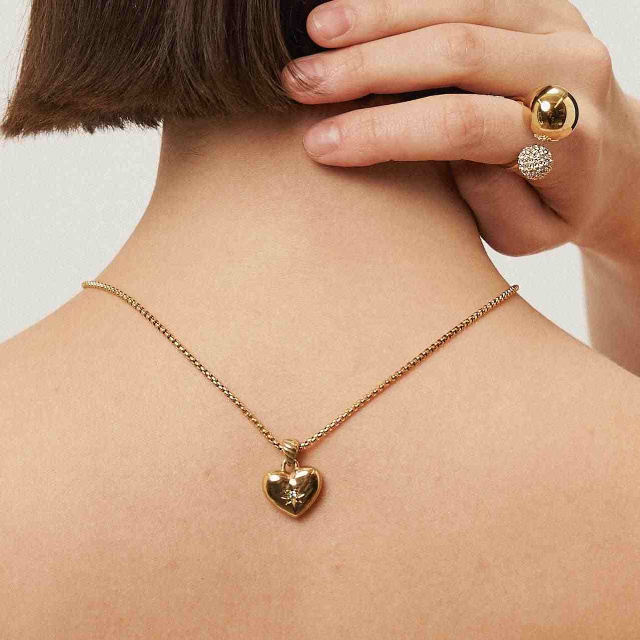 Girl wearing 18k gold plated Necklace and Adjustable ring. Buy Now. Mithra and Co.