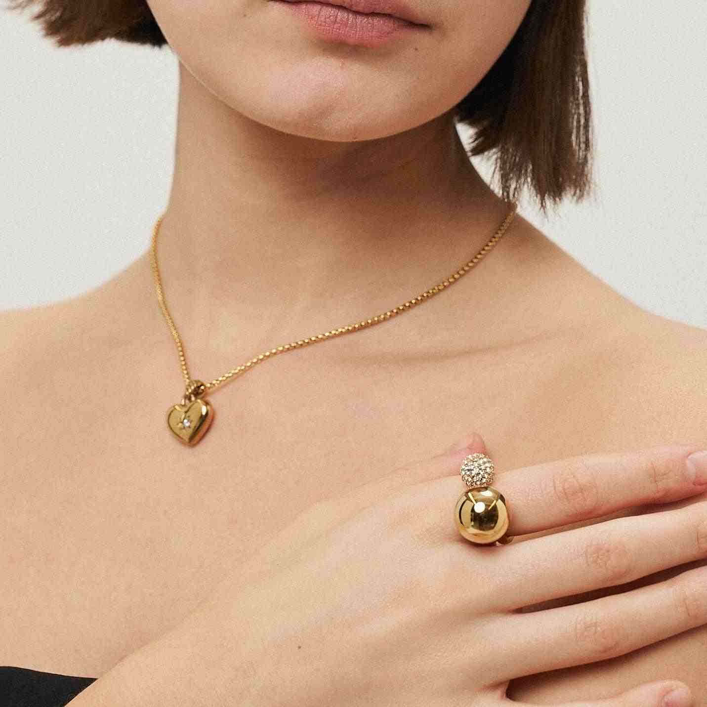 Girl wearing 18k gold plated Adjustable ring and Necklace. Buy at Mithra and Co.