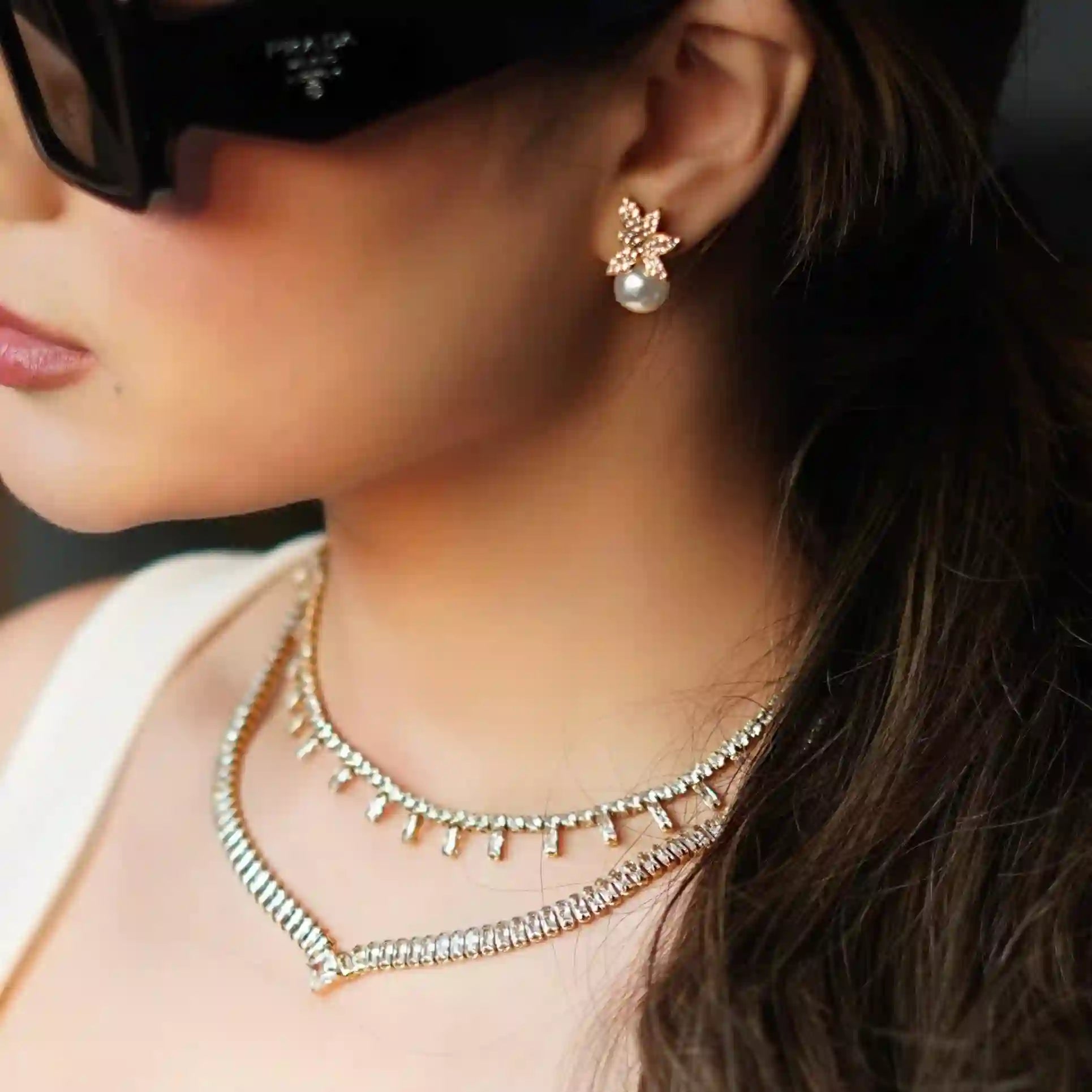 Girl wearing Pirouette - 18k Gold Plated Crystal Flower Stud Earrings. Buy Online at Mithra and Co.