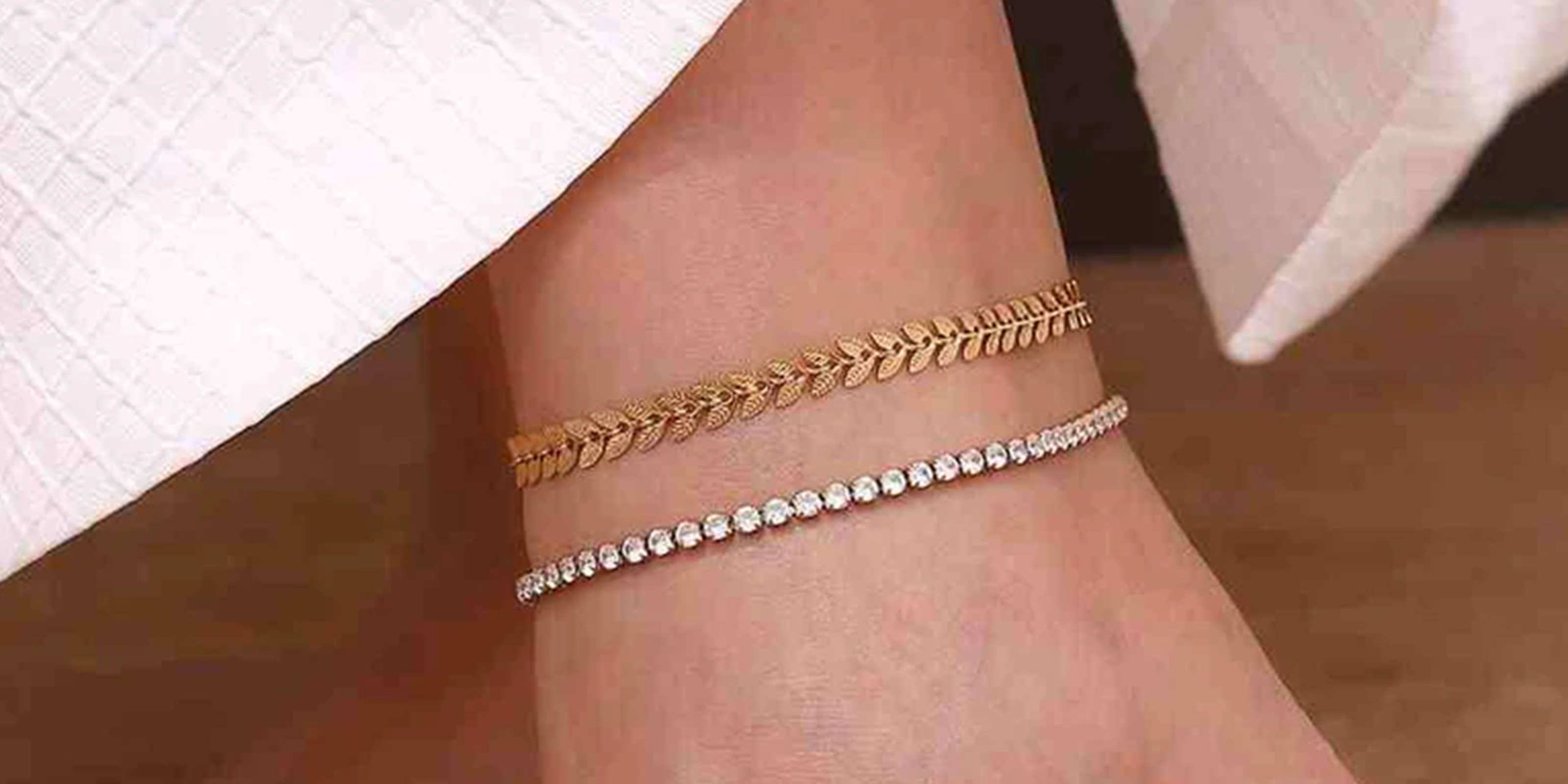Close-up of a girl's foot wearing 2 gold plated anklets, anklets for women, shop stylish and minimal luxury anklet for women online pakistan.