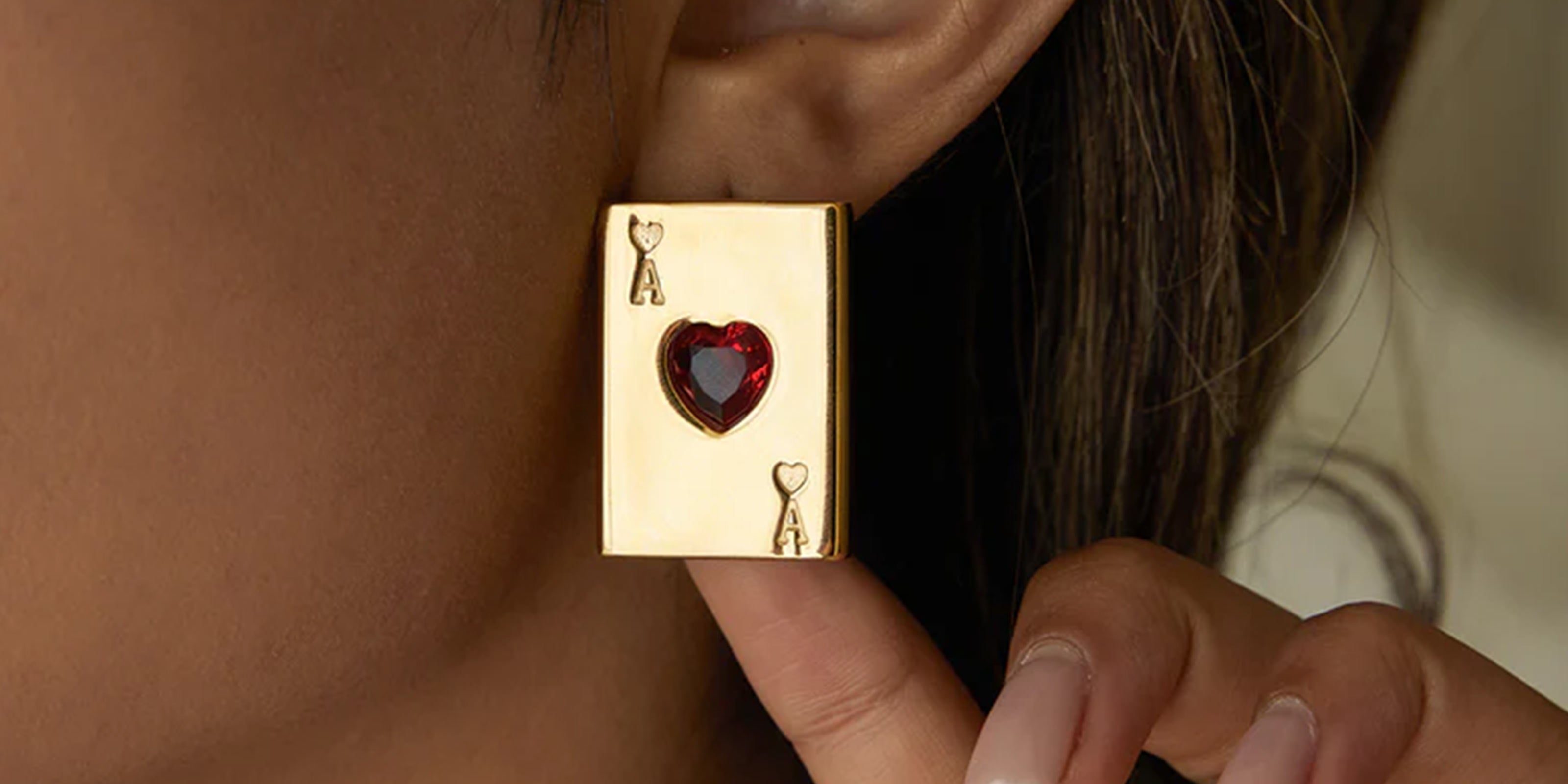 Gold Plated earrings Collection Showcasing Girl wearing Ace-of hearts shaped zrcon gemstone ring