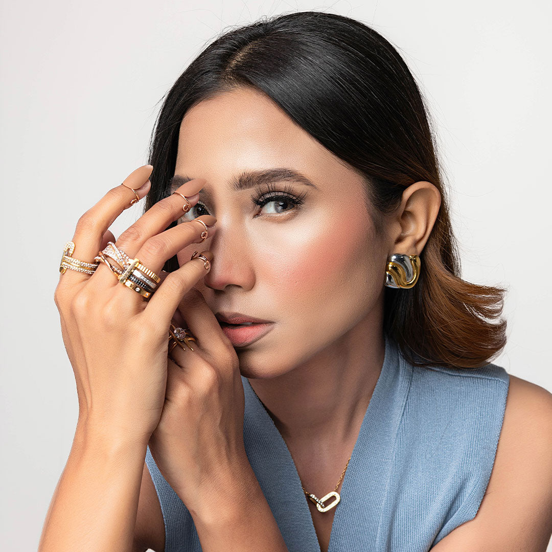 Girl Posing wearing multiple rings styling. Buy Rings Online at Mithra Official Pakistan.