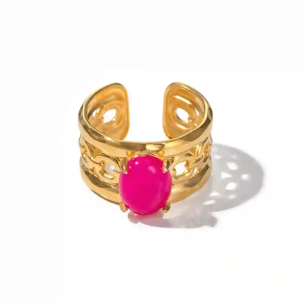 Studio shot of Berry blush ring feauring an 18k gold plated open cuff filigree lattice band design with blush pink opal stone.