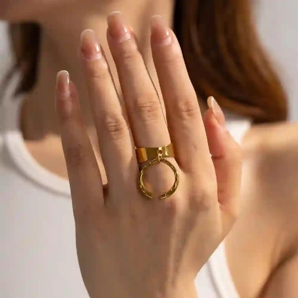 Girl wearing Cistern ring in middle finger. 18k Gold Plated Dual Hoop Buckle interlinked band ring.
