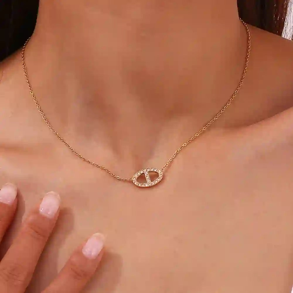 Girl wearing Dreams Necklace - 18k Gold Plated Zircon-Encrusted Oval Station Pendant. Shop at Mithra and Co.
