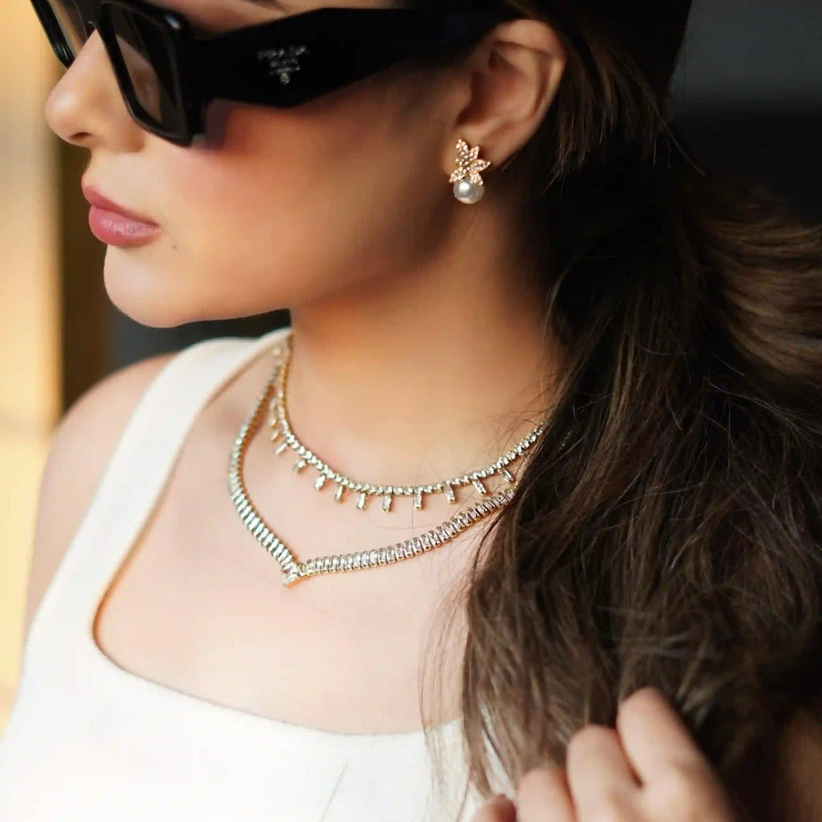 Girl wearing legacy necklace with heritage halo neck chain having Dual cuts 8A Zircon Tennis Track.