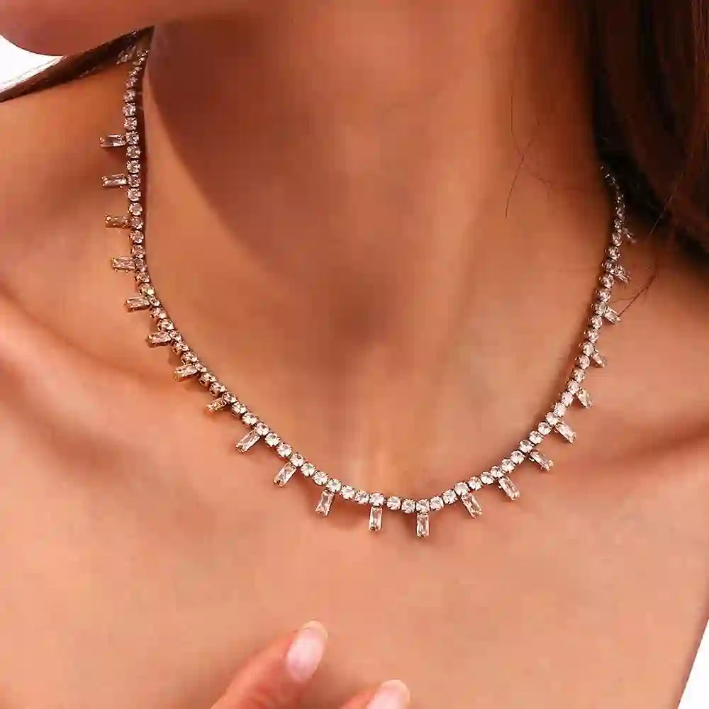 Closeup of a GIrl Wearing 18k Gold Plated Heritage Halo Dual-Cuts Zircon Track Tennis Necklace. Shop at Mithra and Co.