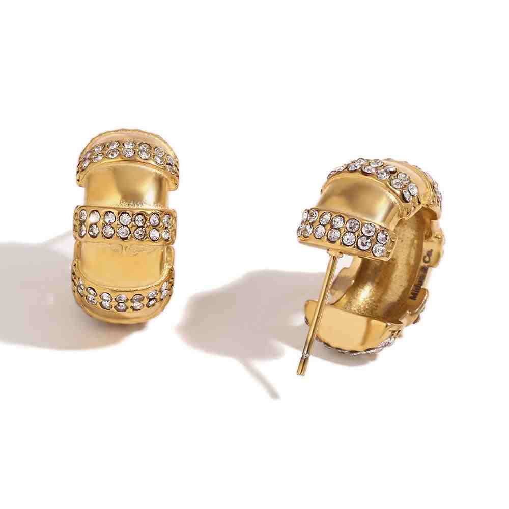 studio shot of Imperial huggie earrings. Featuring Triple-Tier Pavé Band Architecture.