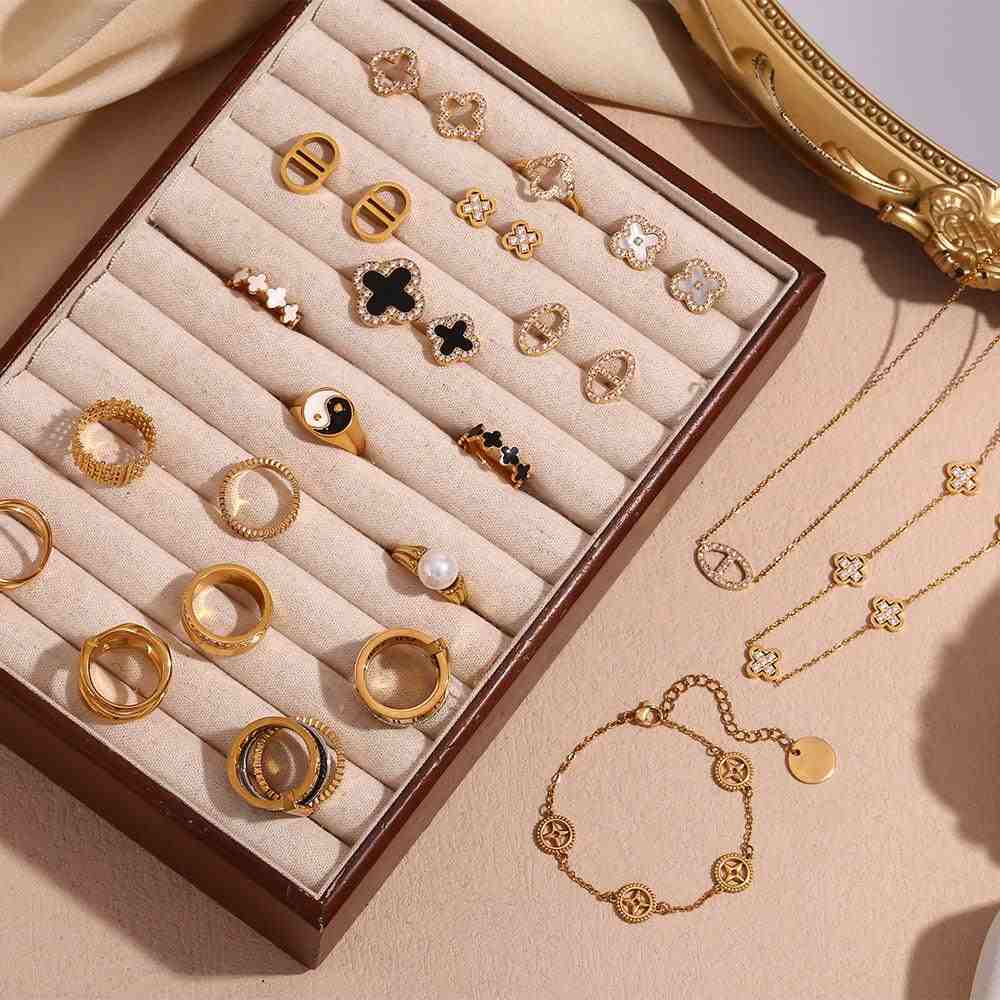 Display of Mithra and Co's Make a Statement Jewellery Collection including White Clover Opal Studs featuring Pavé-Bordered Zircons.