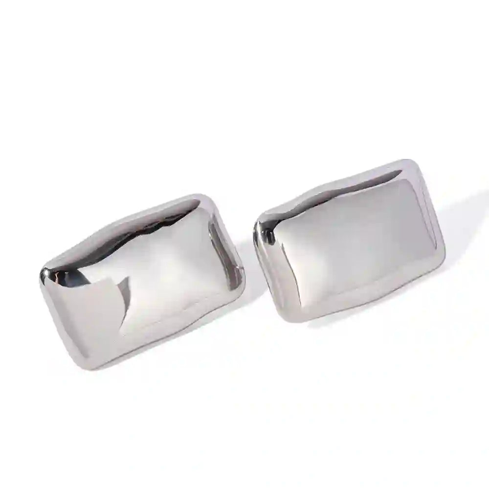 Studio Shot of Silver Plated Rectangle Shape Earrings - Pharaoh Silver. Having Asymmetric Soft-Edge Rectangular Stud Architecture.