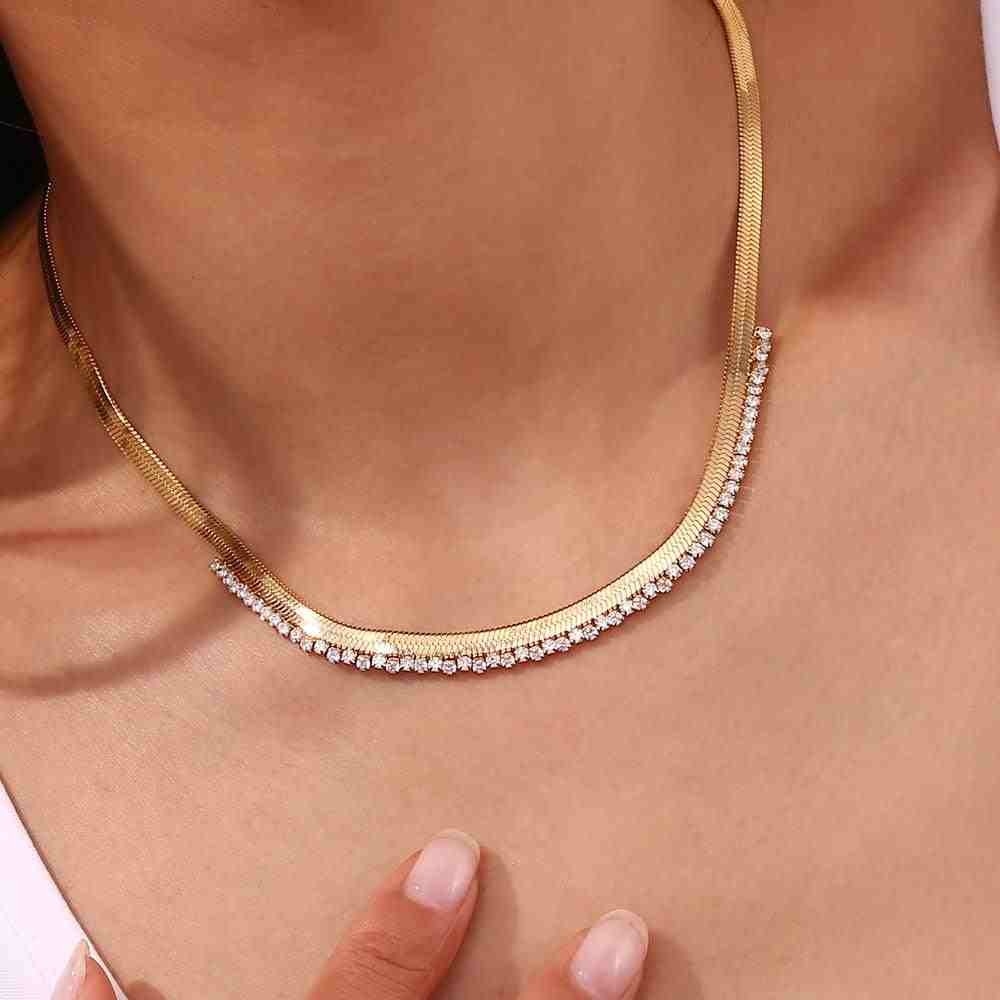 Girl wearing Serenade Gold Necklace with Asymmetric herringbone chain with Zircons at the Edge.