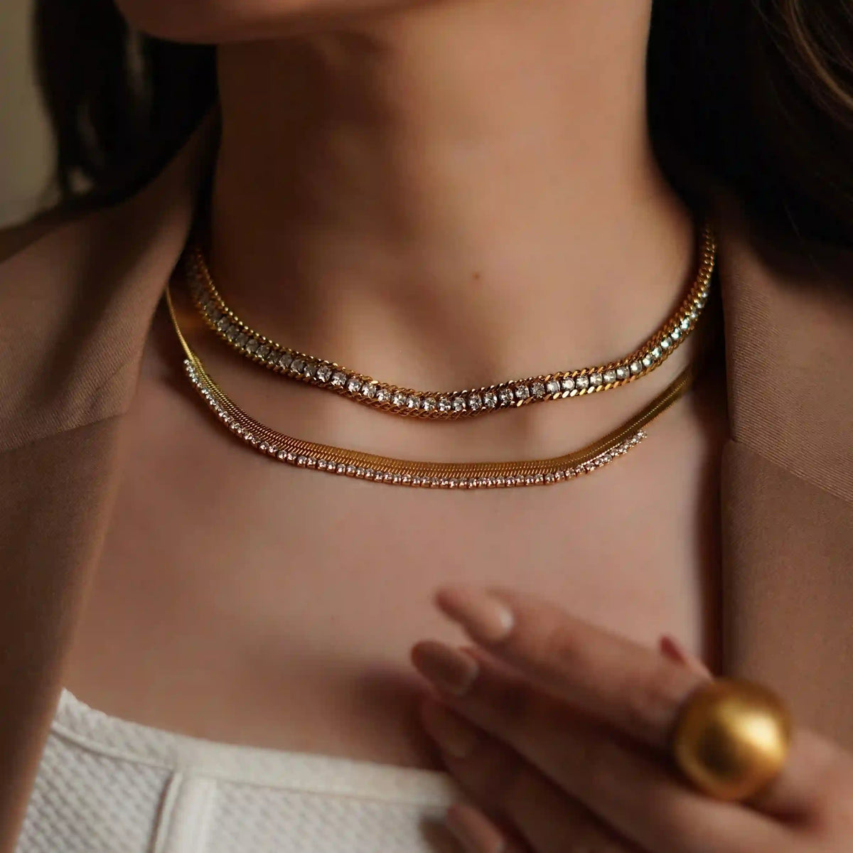 Girl wearing 18k Gold Plated Serenade Gold Necklace with Luster Choker Necklace. Feauring a Parallel Rope chain with Pavé Zircon Strip.