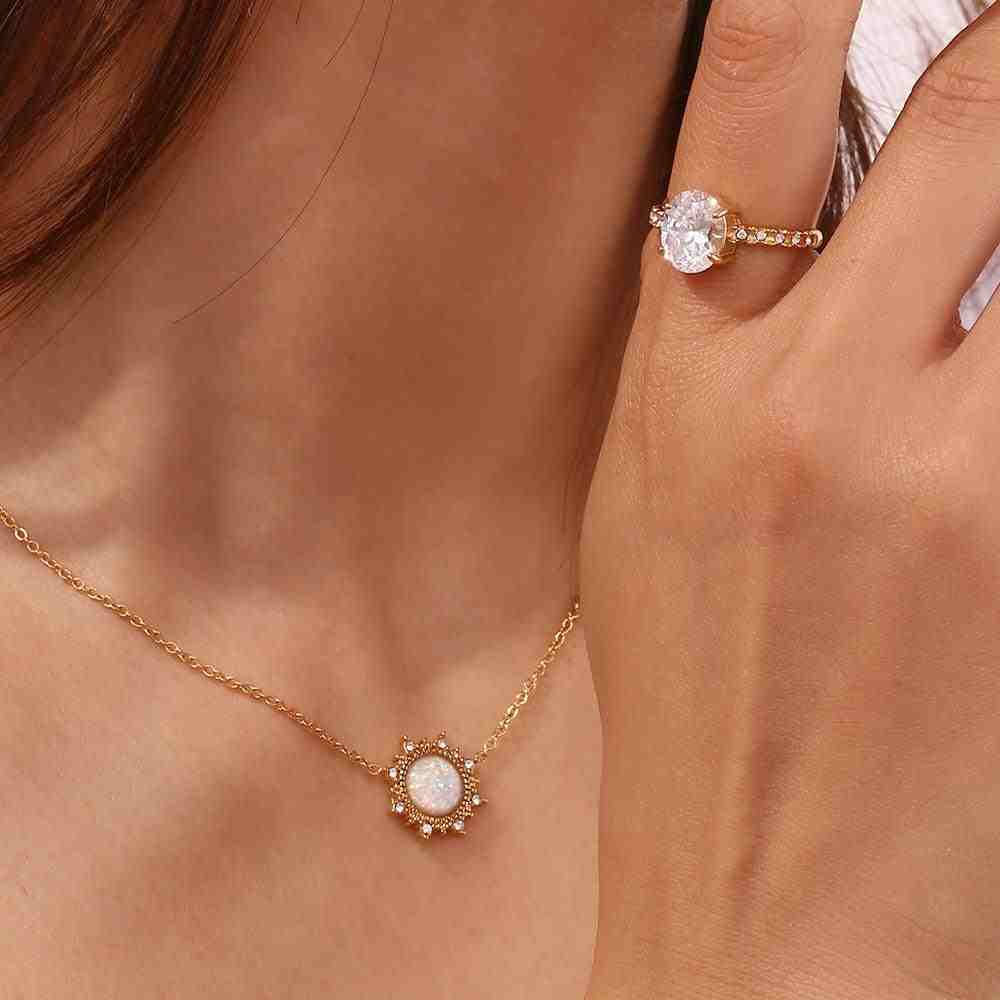 GIrl Wearing Grandeur drop ring with Simple and elegant Sun Opal Necklace with Petite a Sun-Inspired Halo.