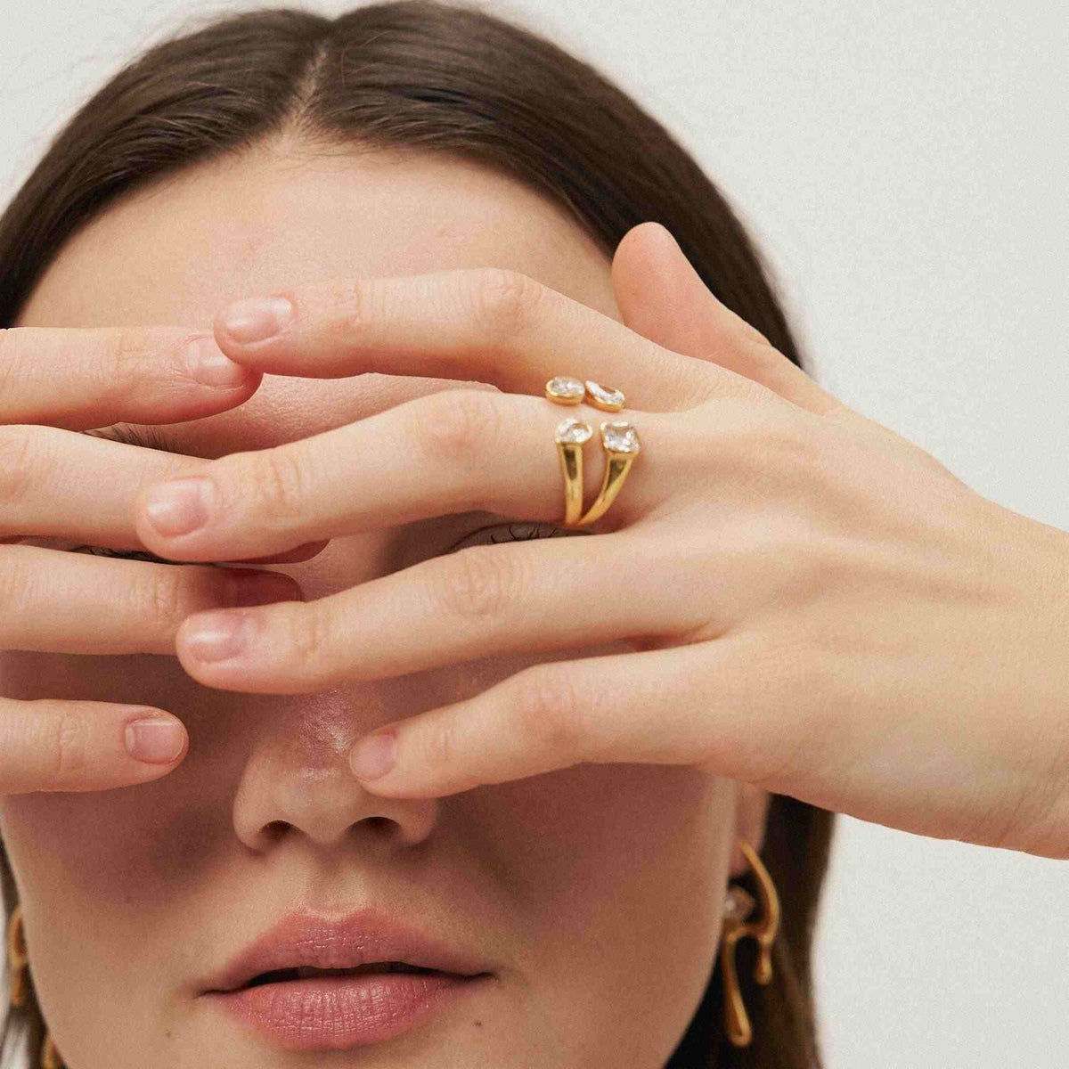 Girl Wearing 18 Gold Plated 4 Stone Mixed Cut Tetra Ring. Shop at Mithra and Co.