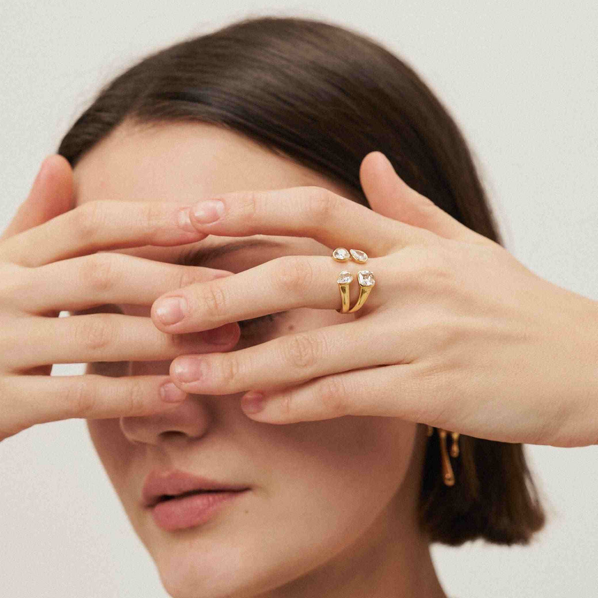 GIrl Wearing 18 Gold Plated 4 Stone Mixed Cut Tetra Ring. Shop at Mithra and Co.