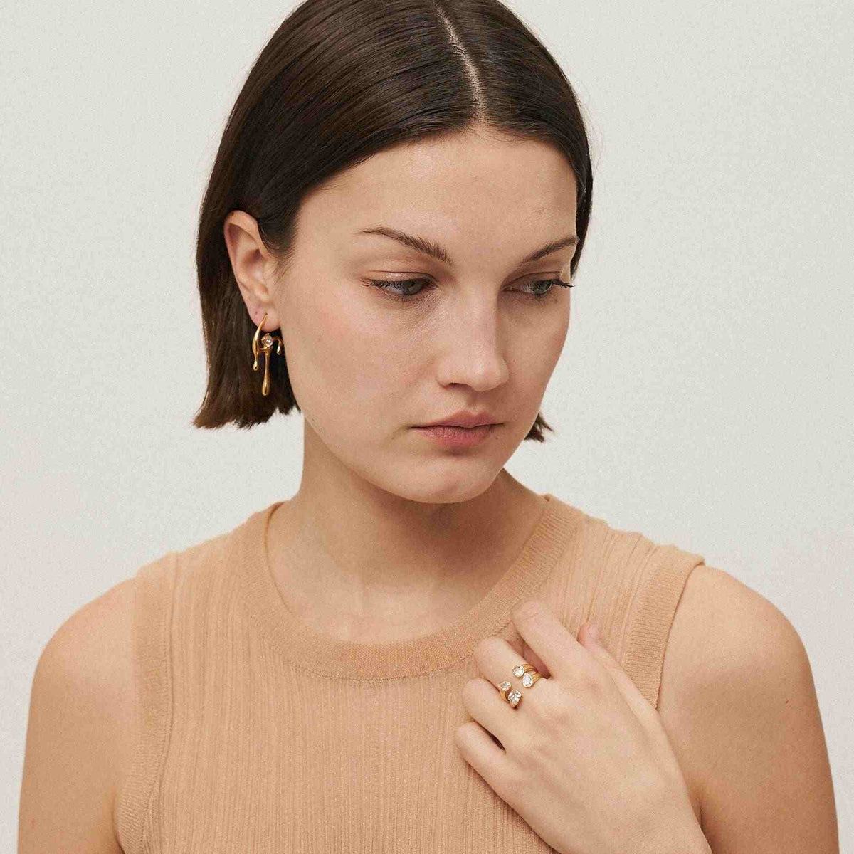 GIrl Wearing Gold Plated 4 stone tetra ring. Shop at Mithra and Co.