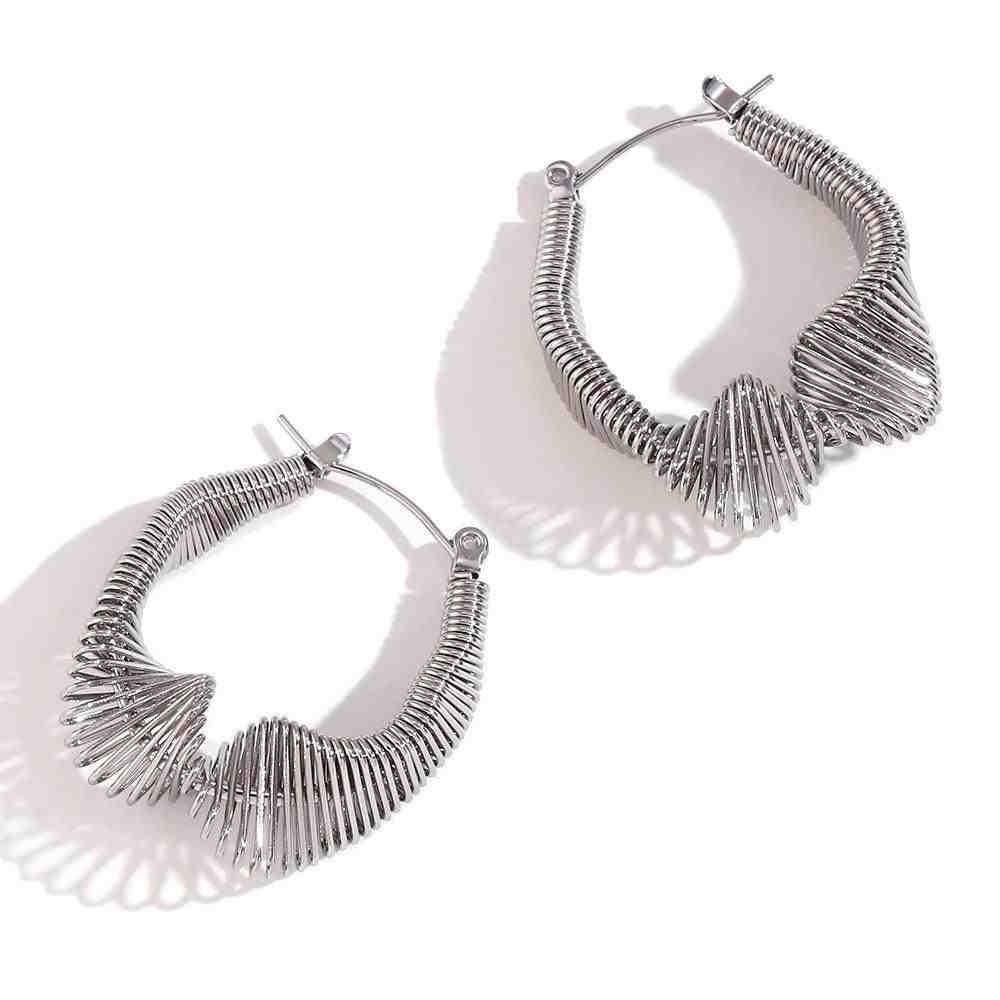 Studio Shot of 925 Sterling Silver Sculptural Wire Mesh Hoop Huggie Earrings - Vela. Shop at Mithra and Co.