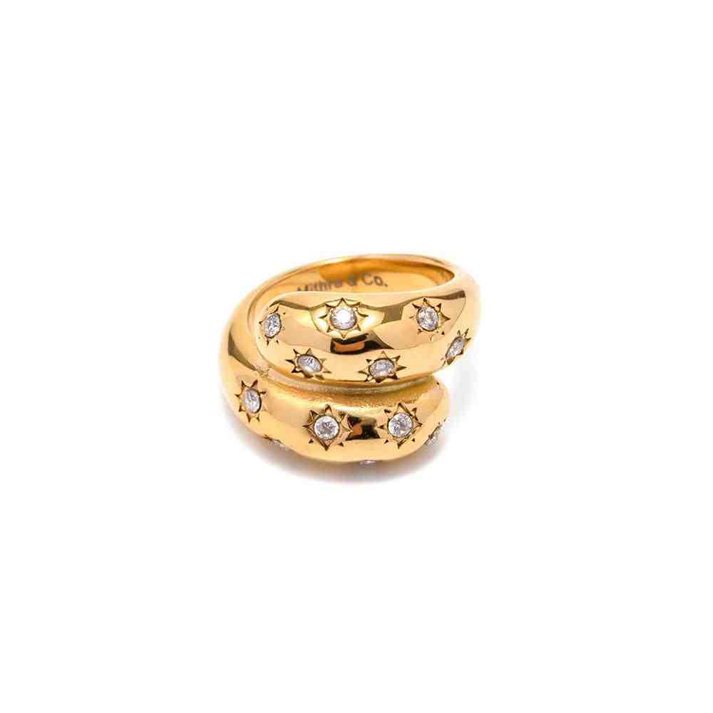 Studio Shot of Celestial Ring with Cosmic Star engraved Wrap-Around Architecture , 18k Gold Plated Stainless Steel Ring with Mithra & Co. Engraved inside.