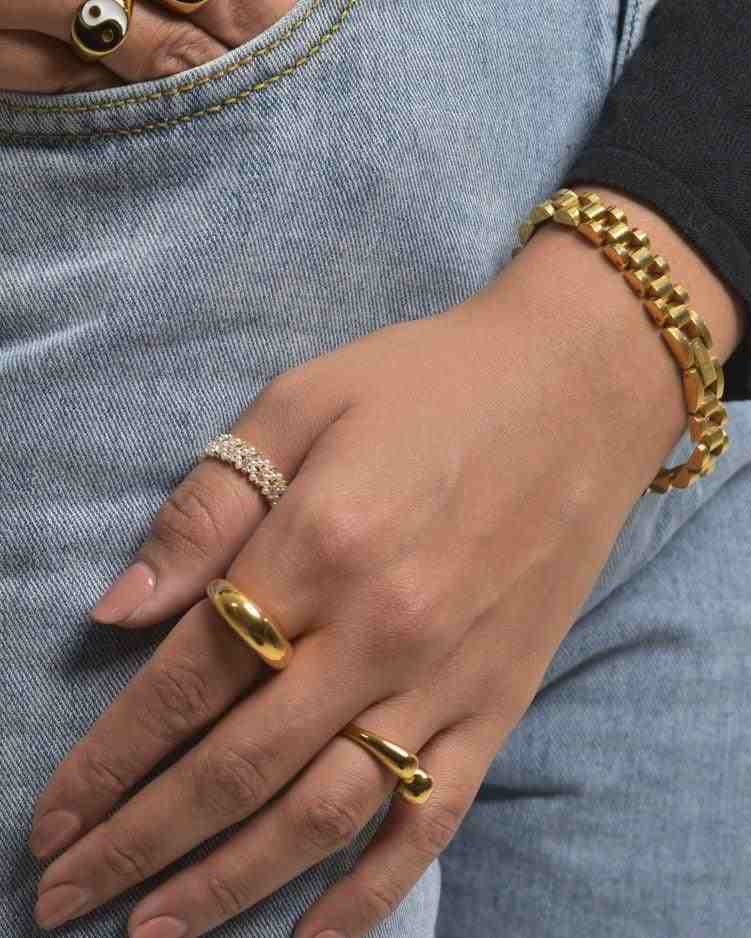 Hand Weearing Michael Bold Watchstrap Bracelet and Gold plated Rings - Shop Online in Pakistan at Mithra and Co.