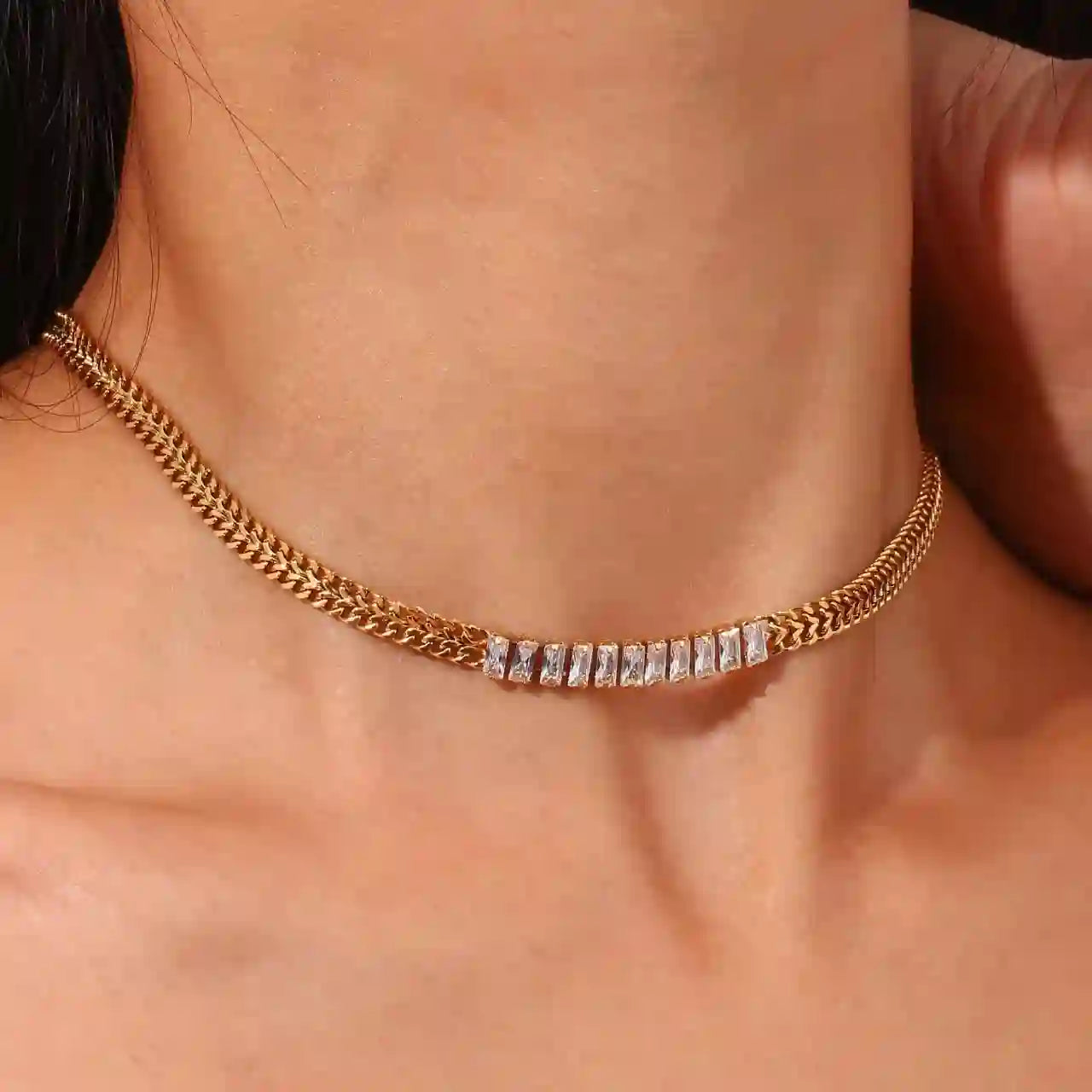 Woman wearing 18k Gold Plated gold chain necklace with rectangular crystal accents close-up
