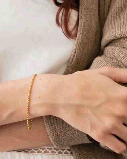 Girl wearing Stainless Steel Braid - 18k Gold Plated Twist chain bracelet. Buy Online Pakistan.