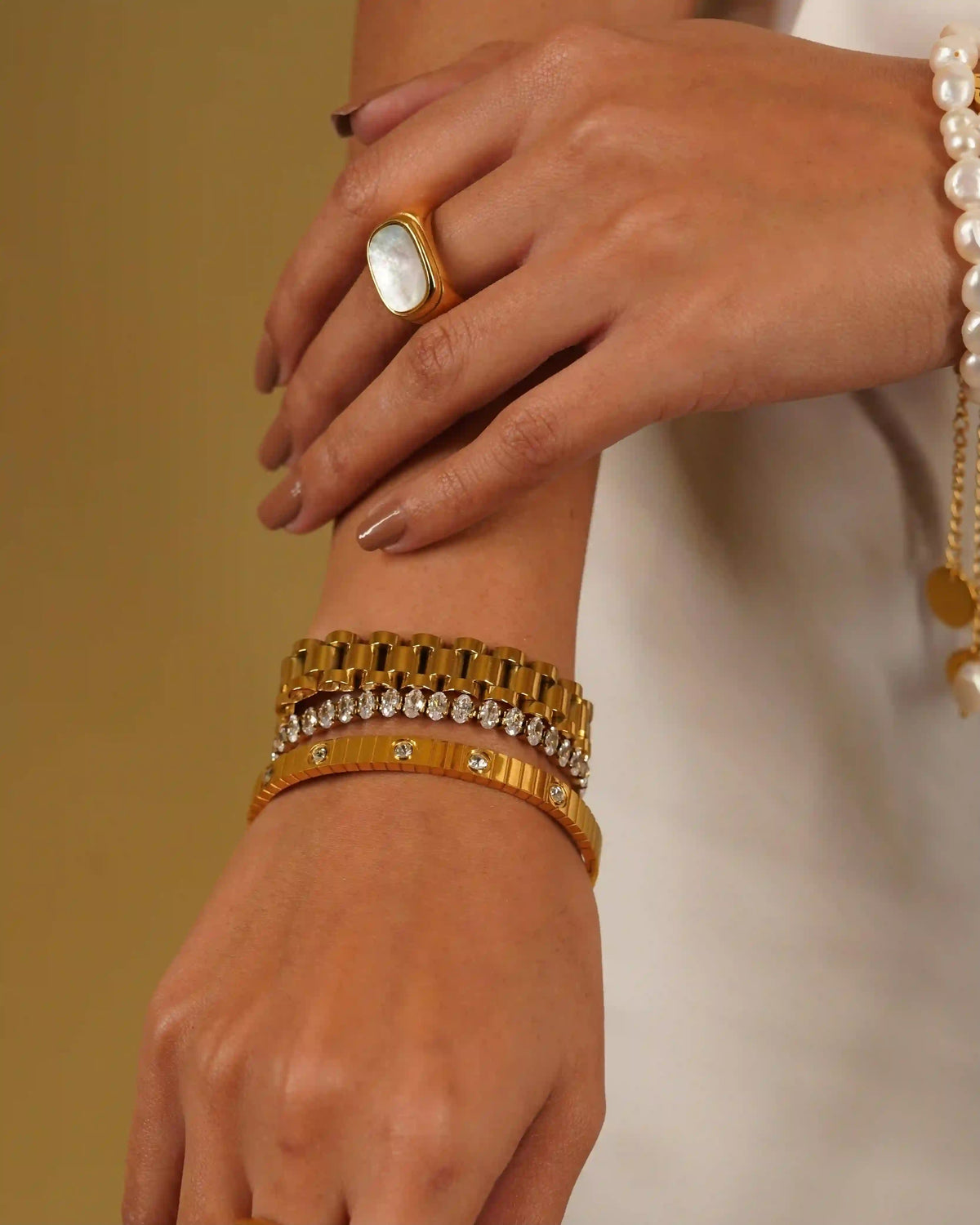 18k Gold plated Kendall diamontee and michael bold bracelet stacked with Ribbed Tectured Coil Studded Bangle with Bezel set CZ.