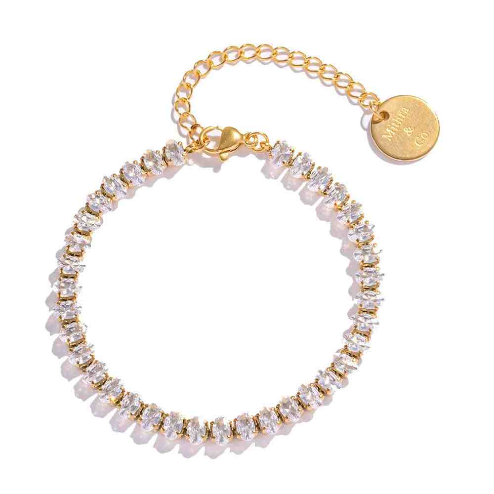 Studio shot of Linea diamond cut bracelet. Gold plated tennis style box chain link bracelet on a white background
