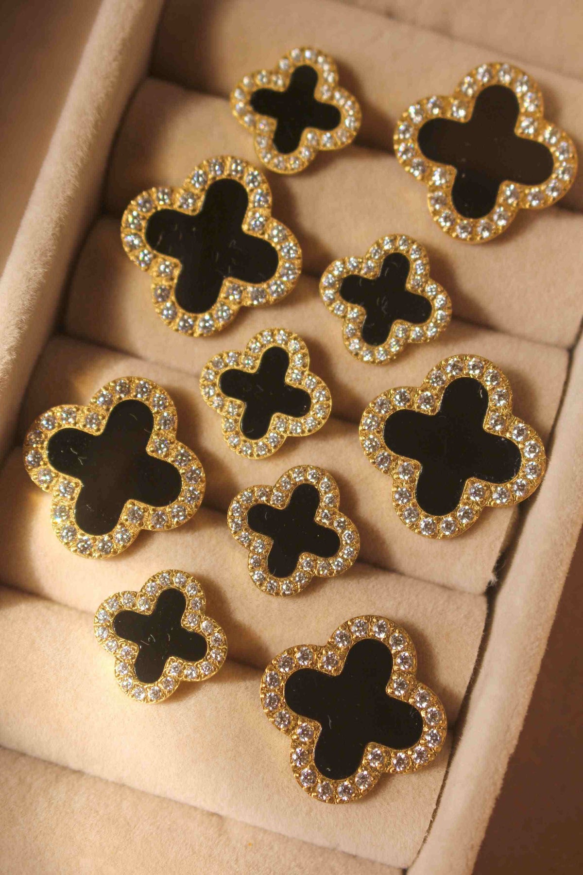5 Midnight Clover rings display in a box Featuring Double Black Clover Motifs big and small with pave zircons