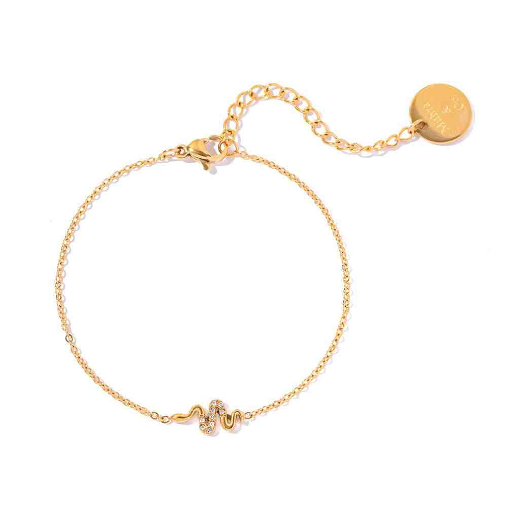 Gold plated petite snake bracelet with a Pavé Slither Motif dainty hand chain and 18k gold plating