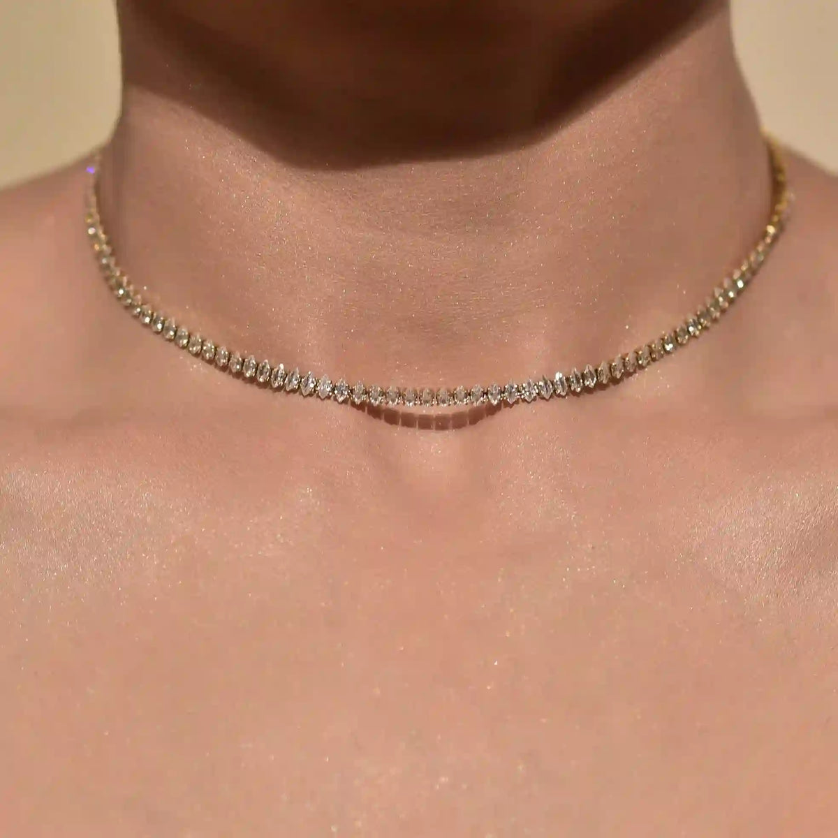 closeup of woman's neck wearing diamond cut neckchain 8A Zircon faceted Gold Plated Choker Chain Necklace. SHop at Mithra and Co.