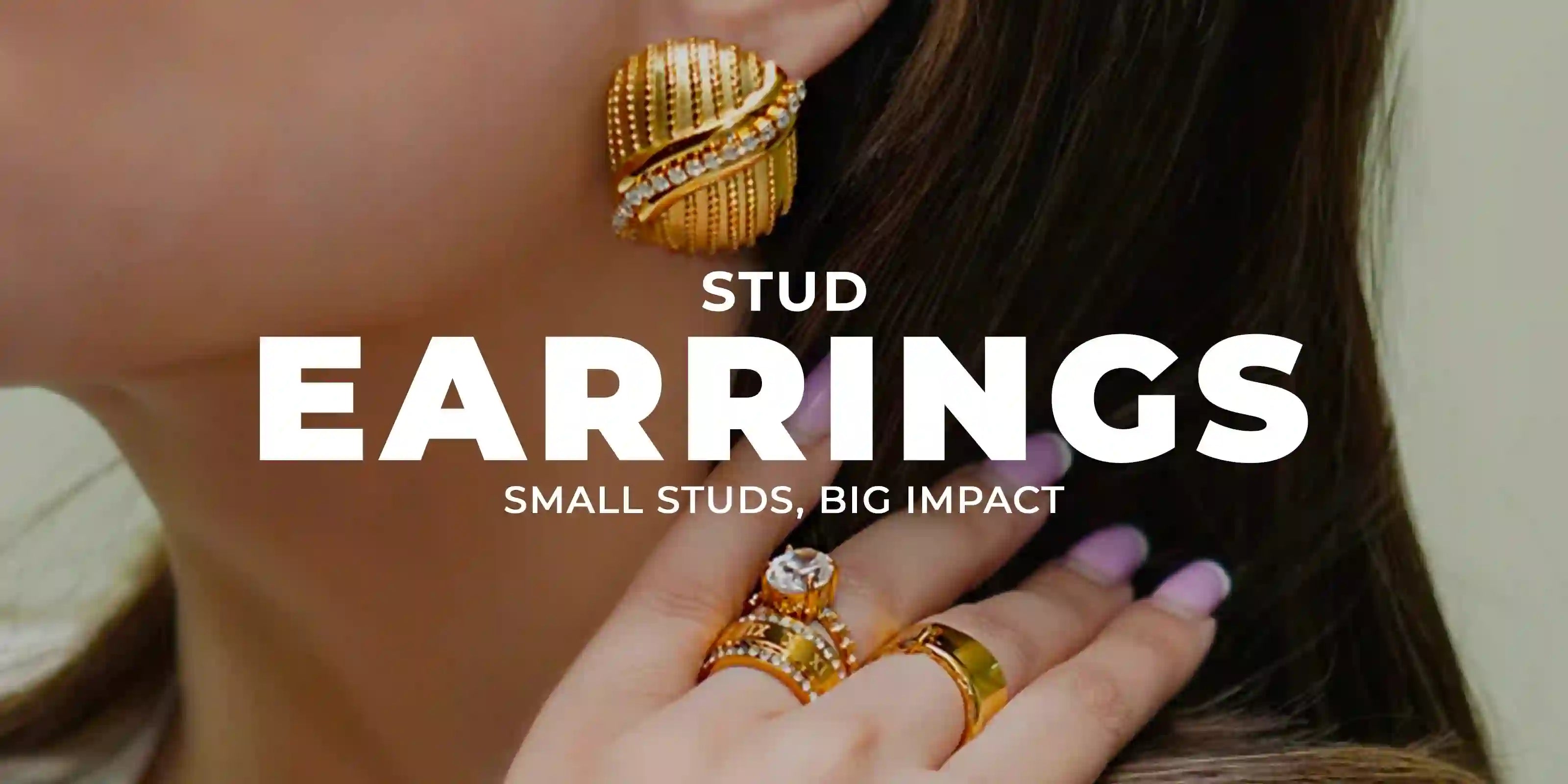 Girl wearing 18k gold plated stud earrings with a hand on shoulder showing rings on two fingers.