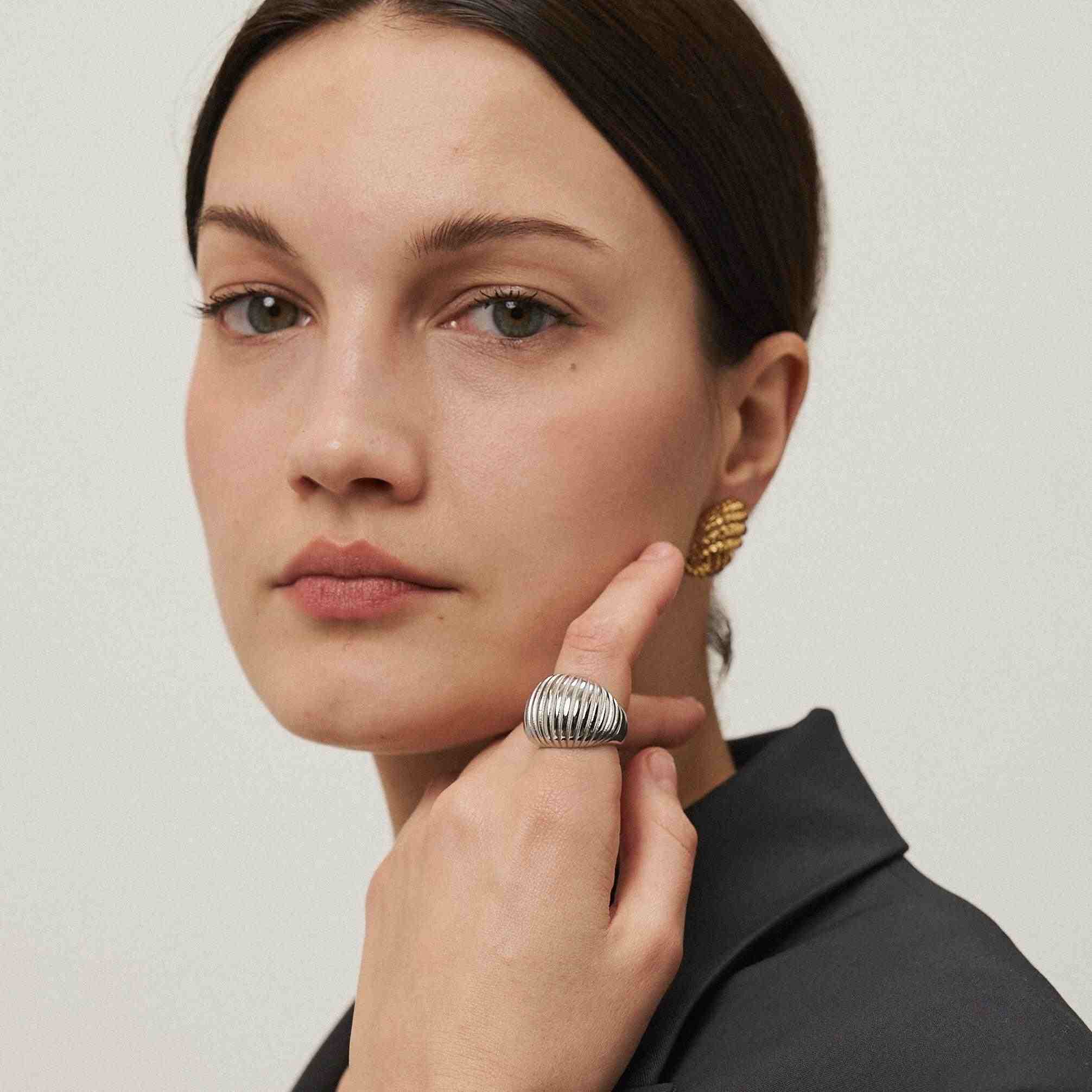 Girl wearing Lumiere 925 silver plated ring. Buy Online at Mithra and Co.