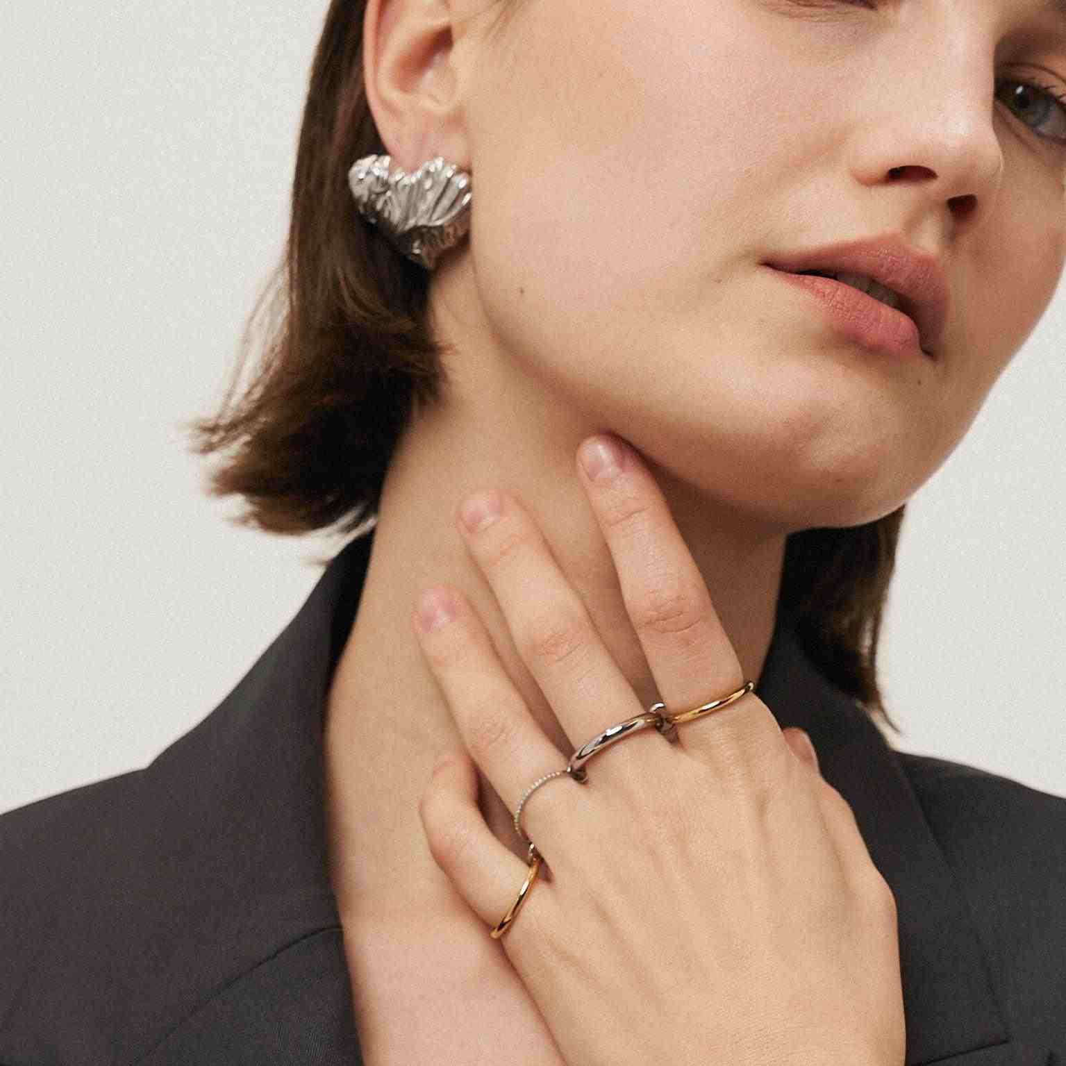 Girl wearing Silver Plated studs. Buy at Mithra and Co.