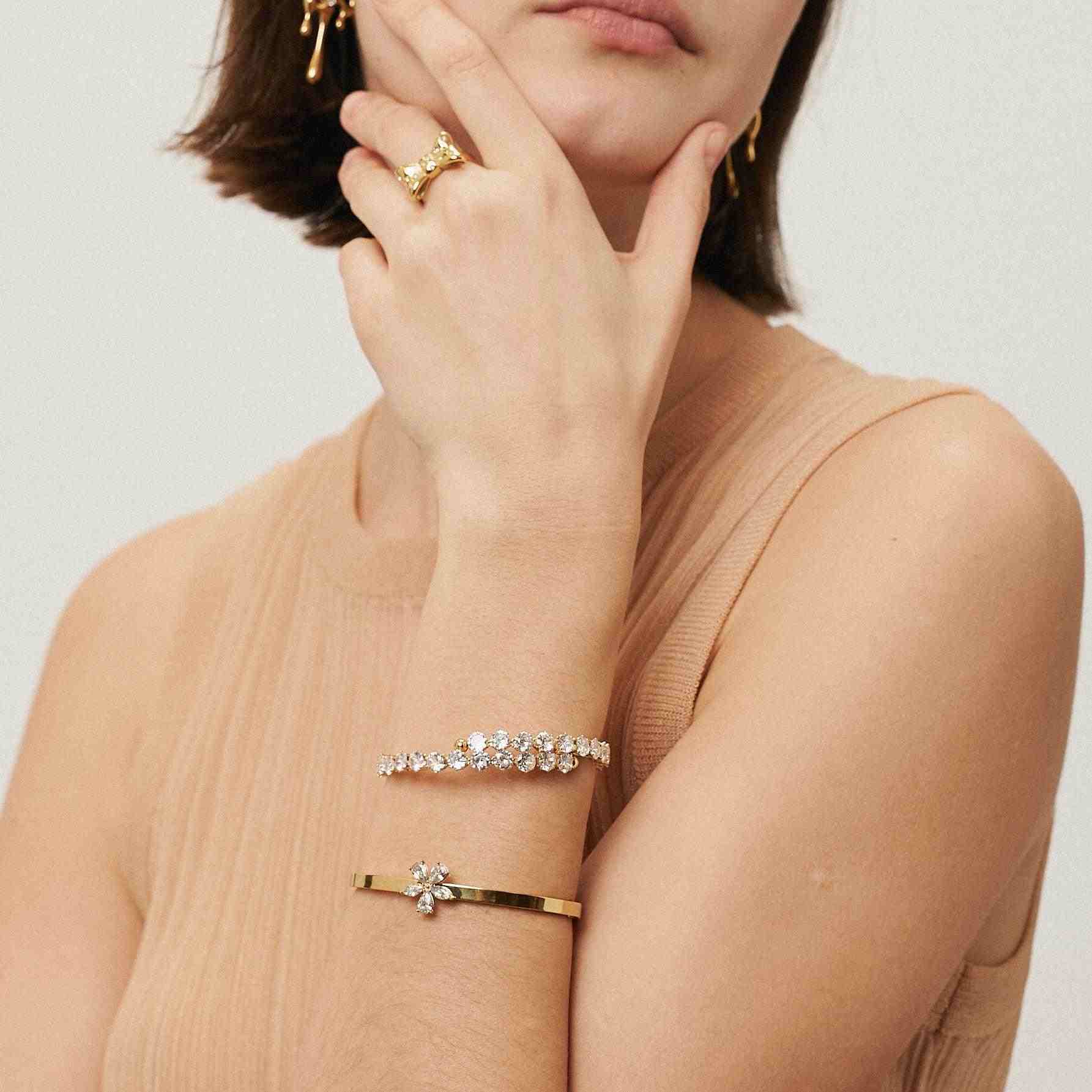 Girl Wearing 18k Gold Plated bangles. Shop Online at Mithra and Co.