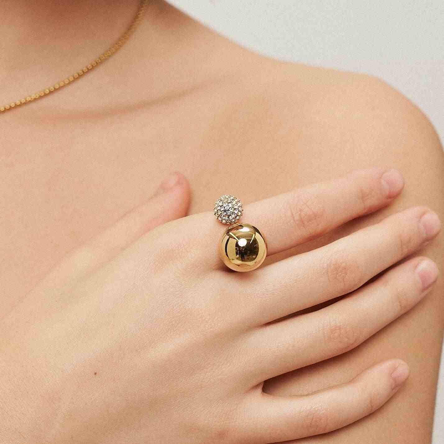 Wearing 18k Gold Plated Double Ball Zenith Sphere Ring. Shop at Mithra and Co.