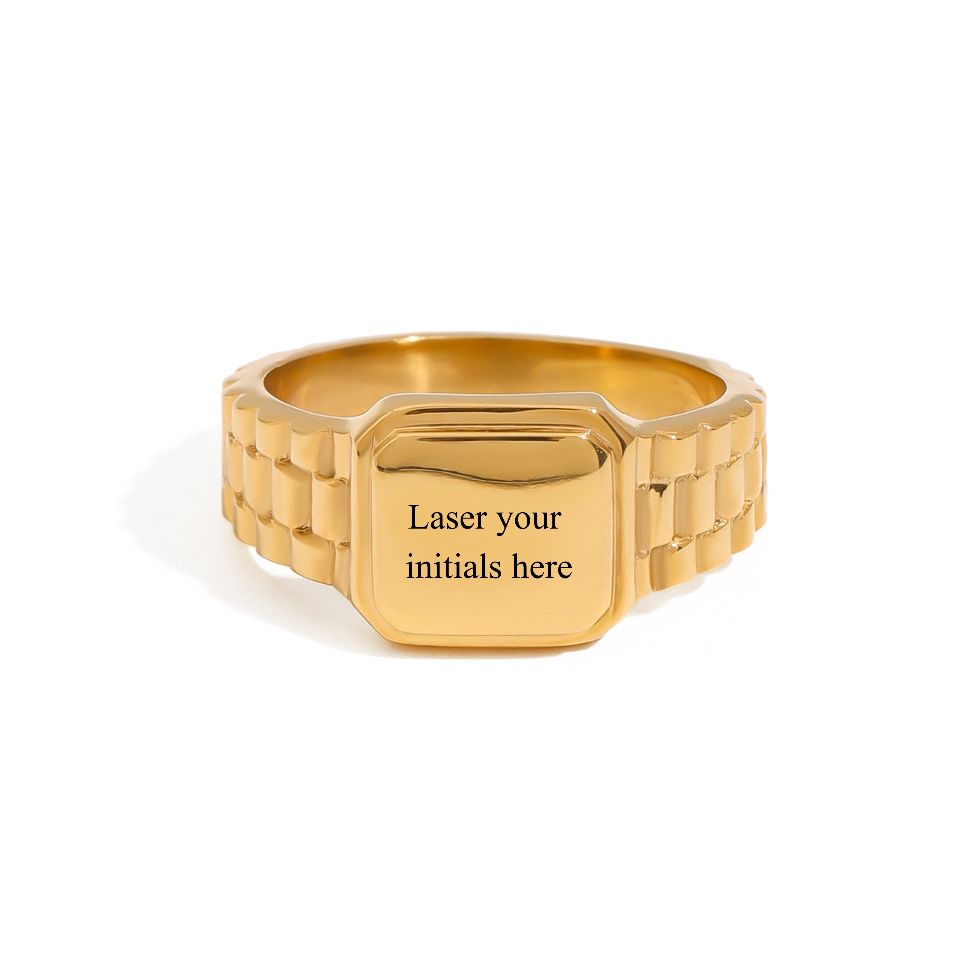 A gold-colored metal ring with a textured band and a flat, octagonal face engraved with the text 'Laser your initials here', shown on a plain white background.