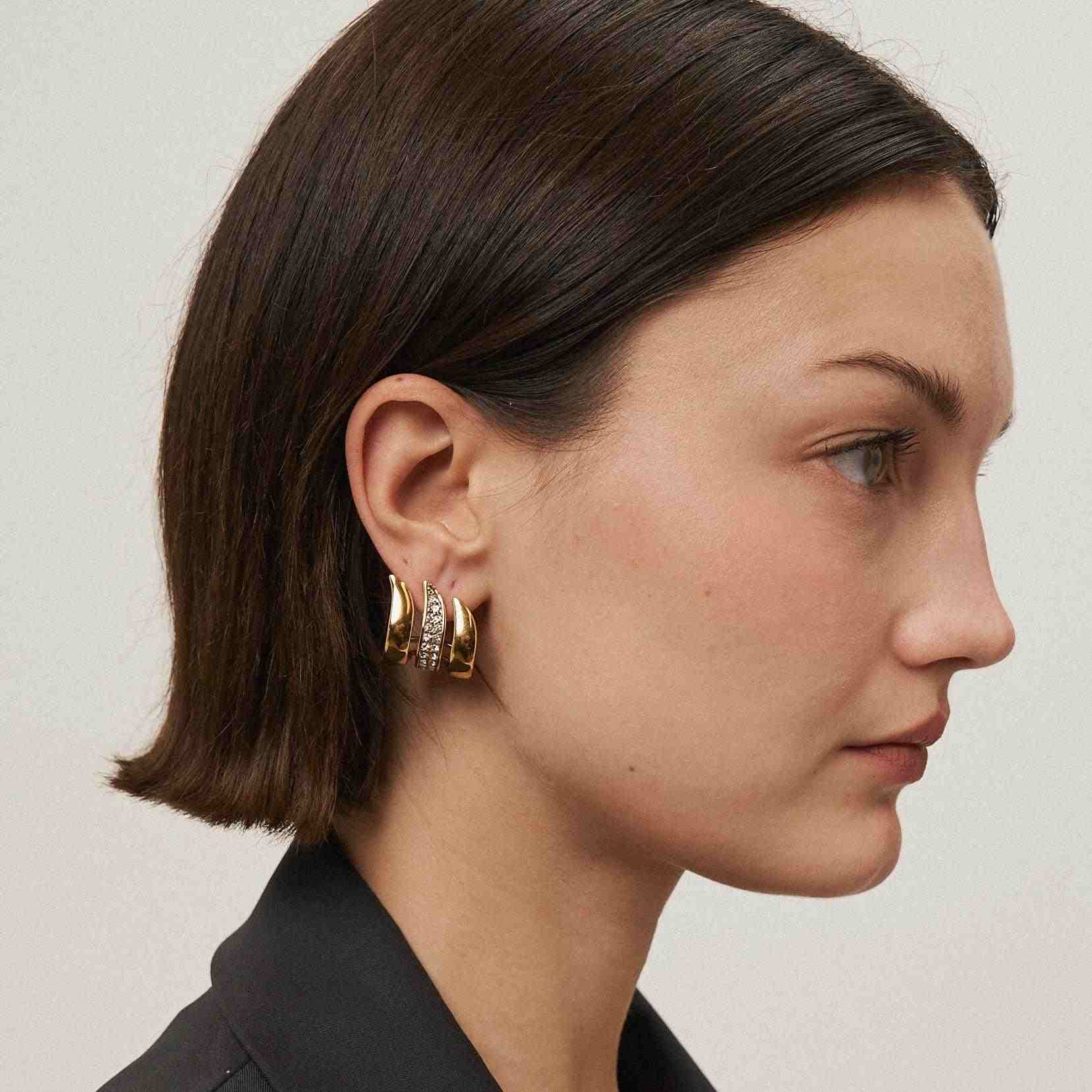 Wearing Flame Earrings Shop Gold Plated earrings at Mithra and Co.