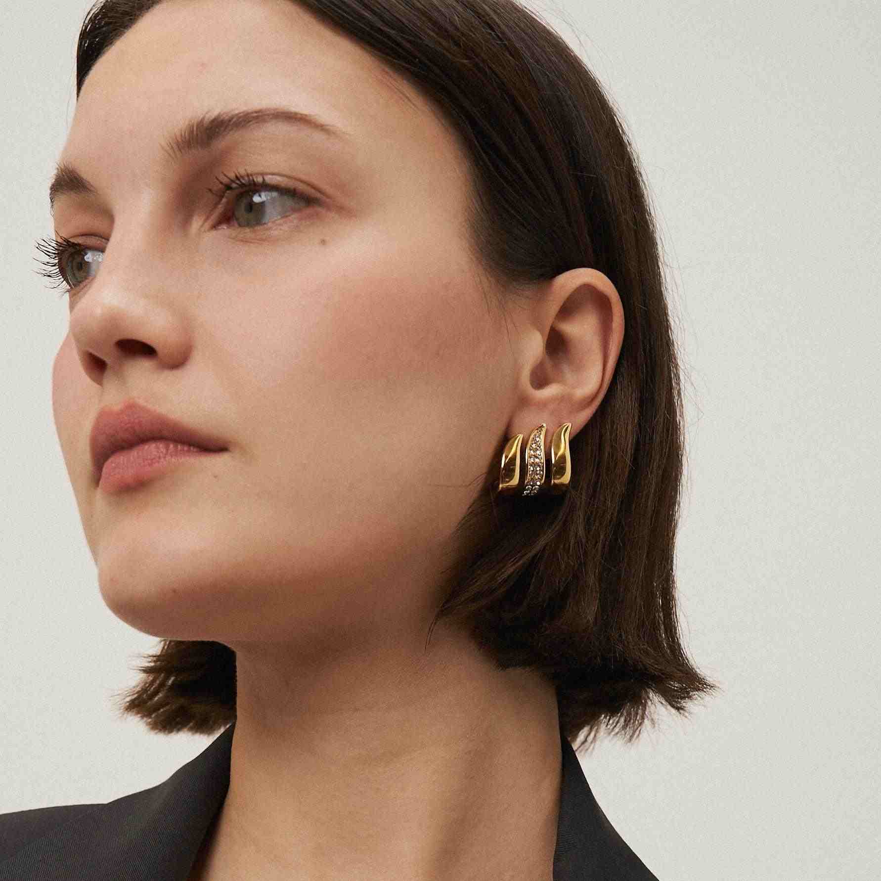 Wearing Flame Earrings. Shop 18k Gold Plated hoops at Mithra and Co.