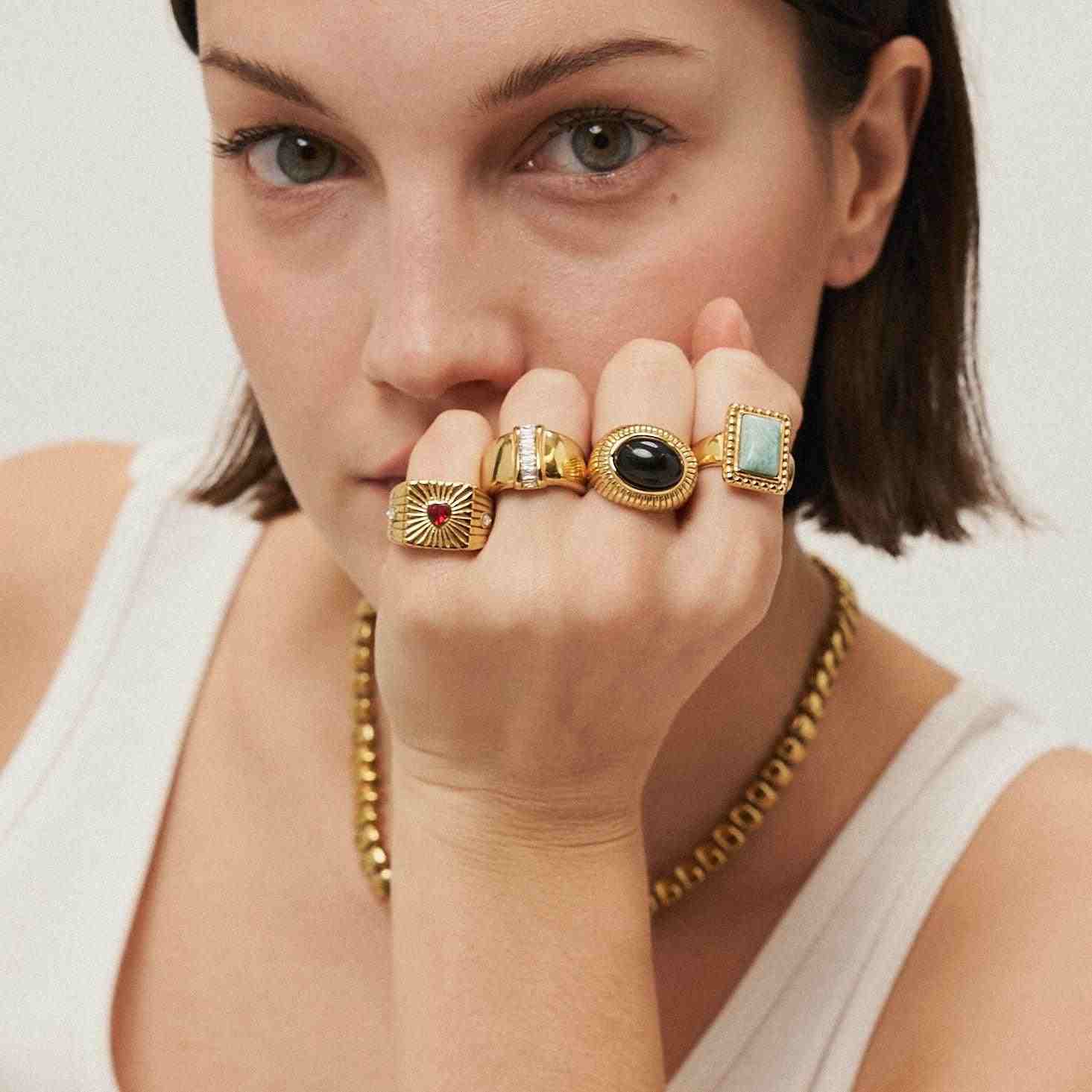 Girl wearing 18k Gold Plated Rings with Stones. Mithra and Co.