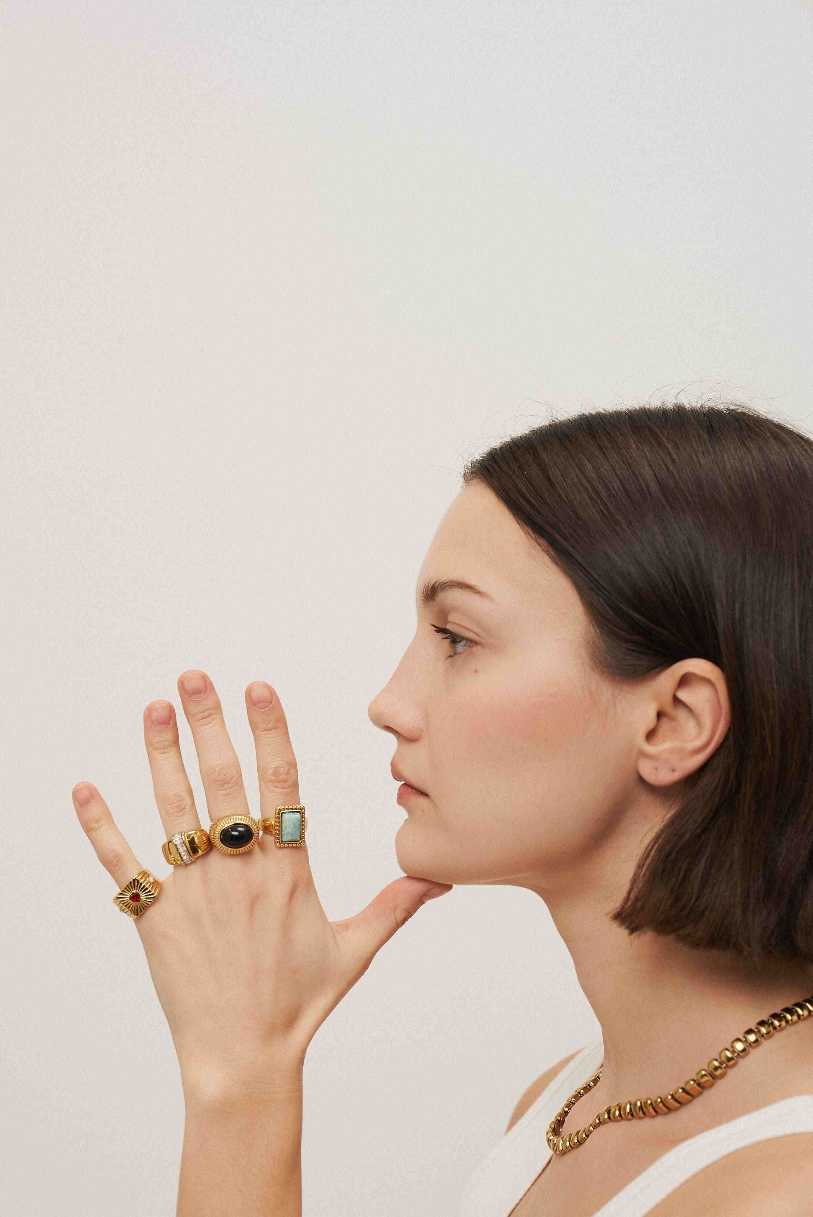 Girl wearing Rings with Stones. 18k Gold Plated. Buy at Mithra and Co.