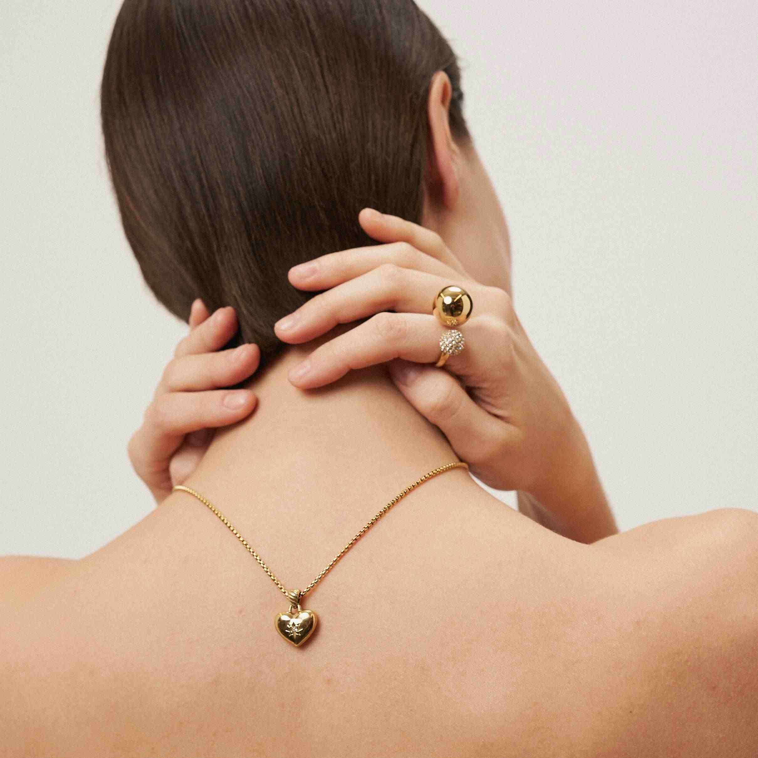 Girl Wearing 18k gold plated ring and necklace. Shop Online at Mithra and Co.
