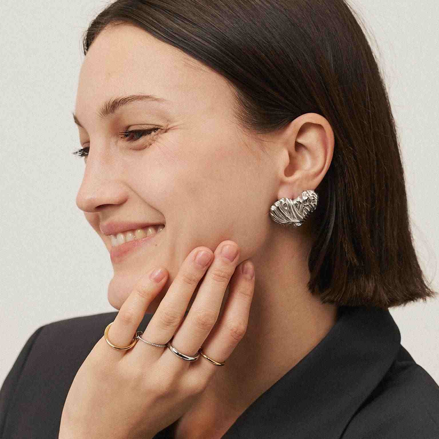 Girl wearing Silver Plated earrings. Shop at Mithra and Co.