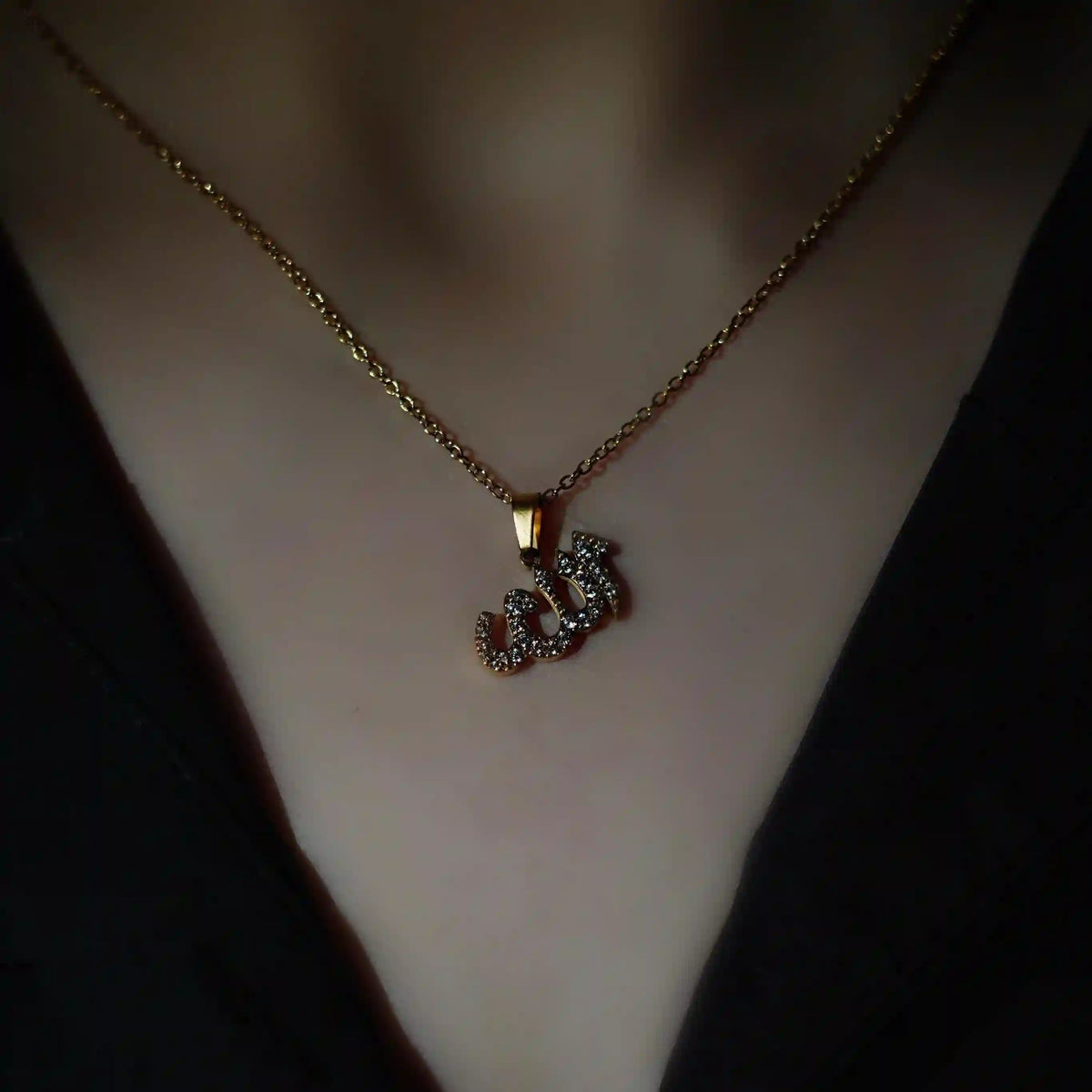 Display of dummy wearing Allah Calligraphy Necklace. Allah Name in Arabic Script made with Pave Crystal Zircons.
