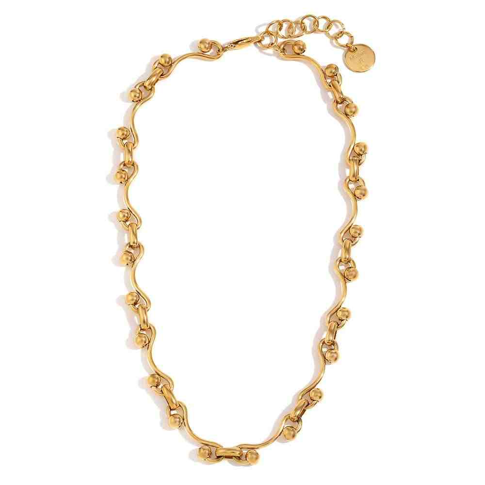 Studio shot of Aristo Necklace. A Greek-Inspired Serpentine Link Architecture Neckchain.