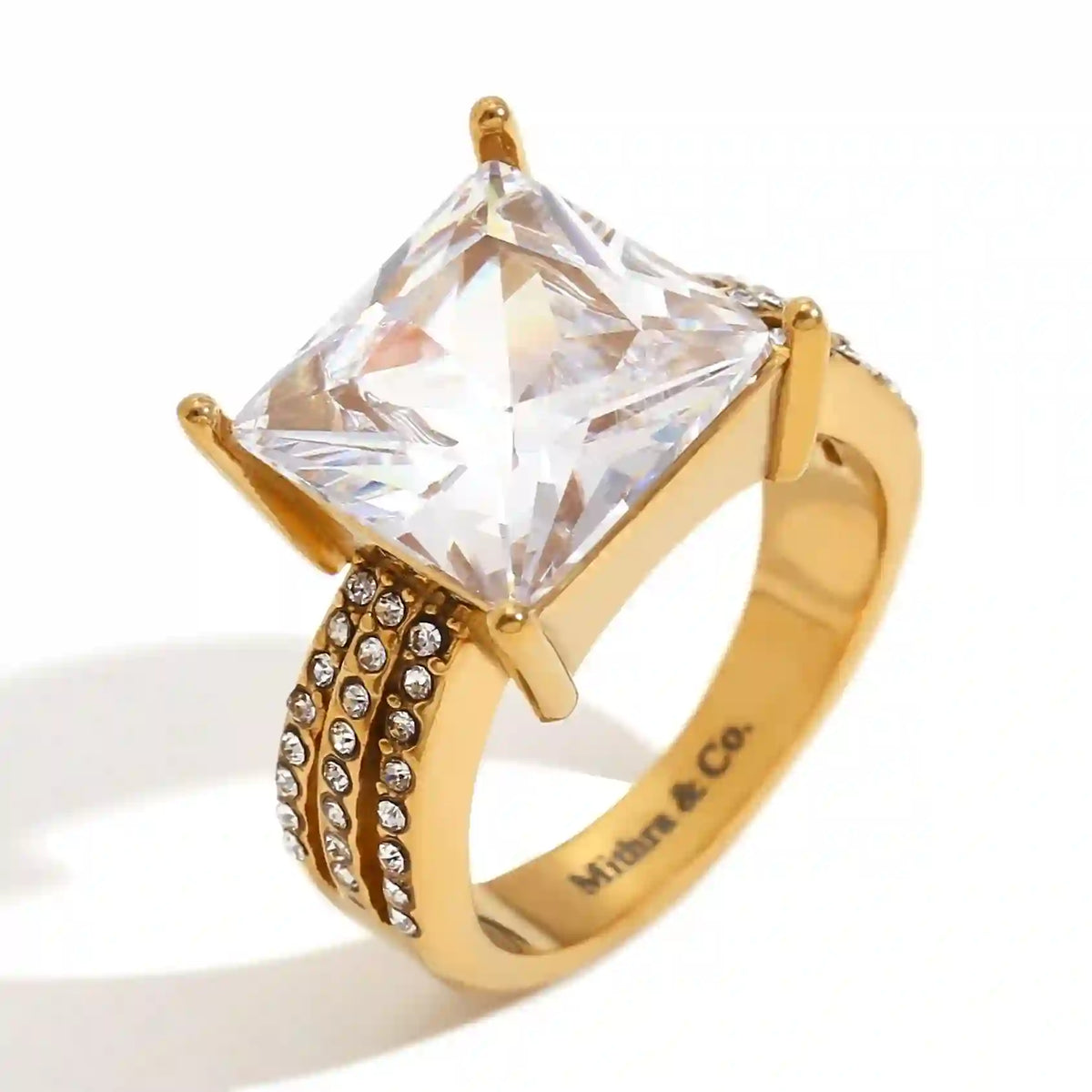 Studio Shot of Waterproof 18k Gold plated Aura Zircon Triple-Row Pavé Band with Large Square Centerpiece. Shop Online at Mithra and Co.