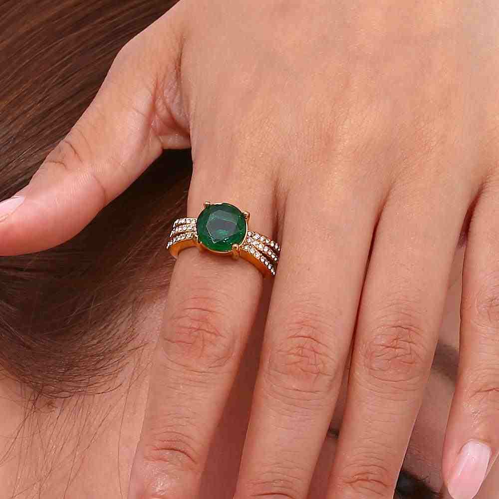Wearing Aurora Emerald gemstone ring with 3 CZ Studded Rows.