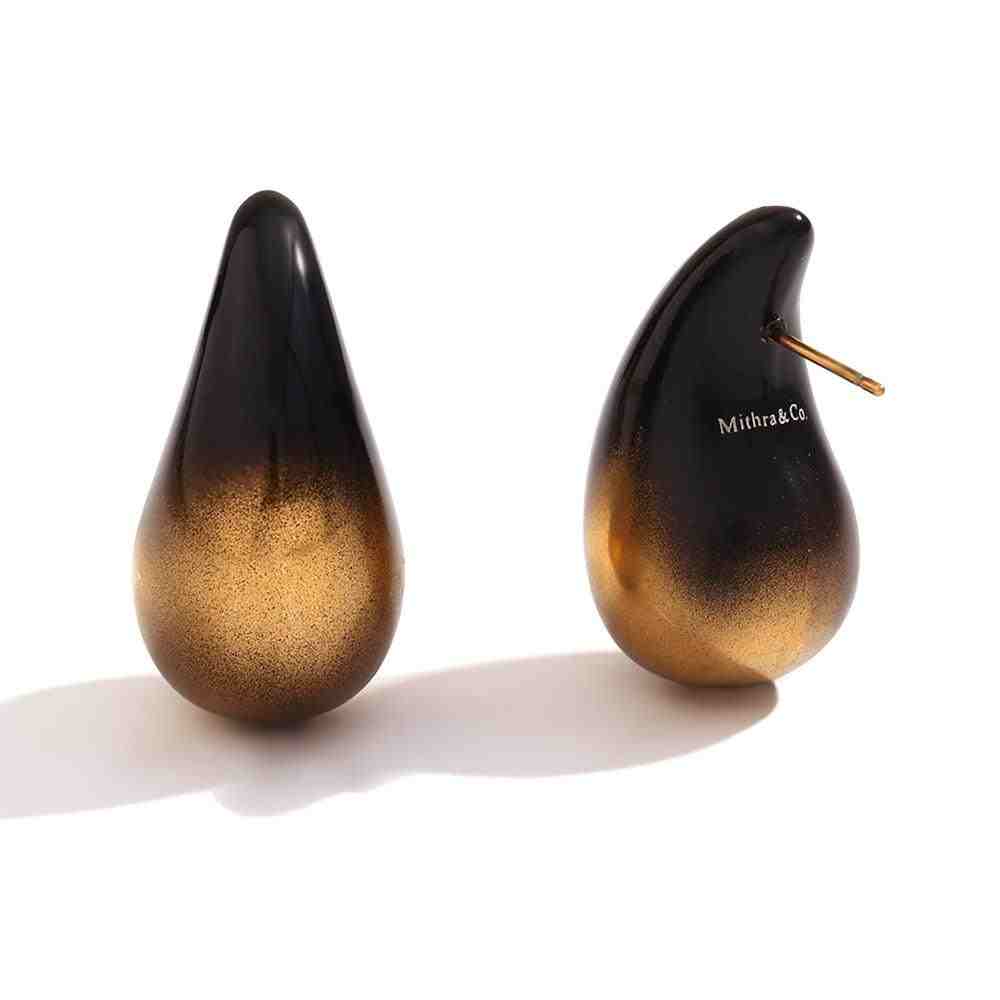 Studio shot of Sculptural Black and Gold Ombre Teardrop Earrings - Avant Garde. Shop at Mithra and Co.